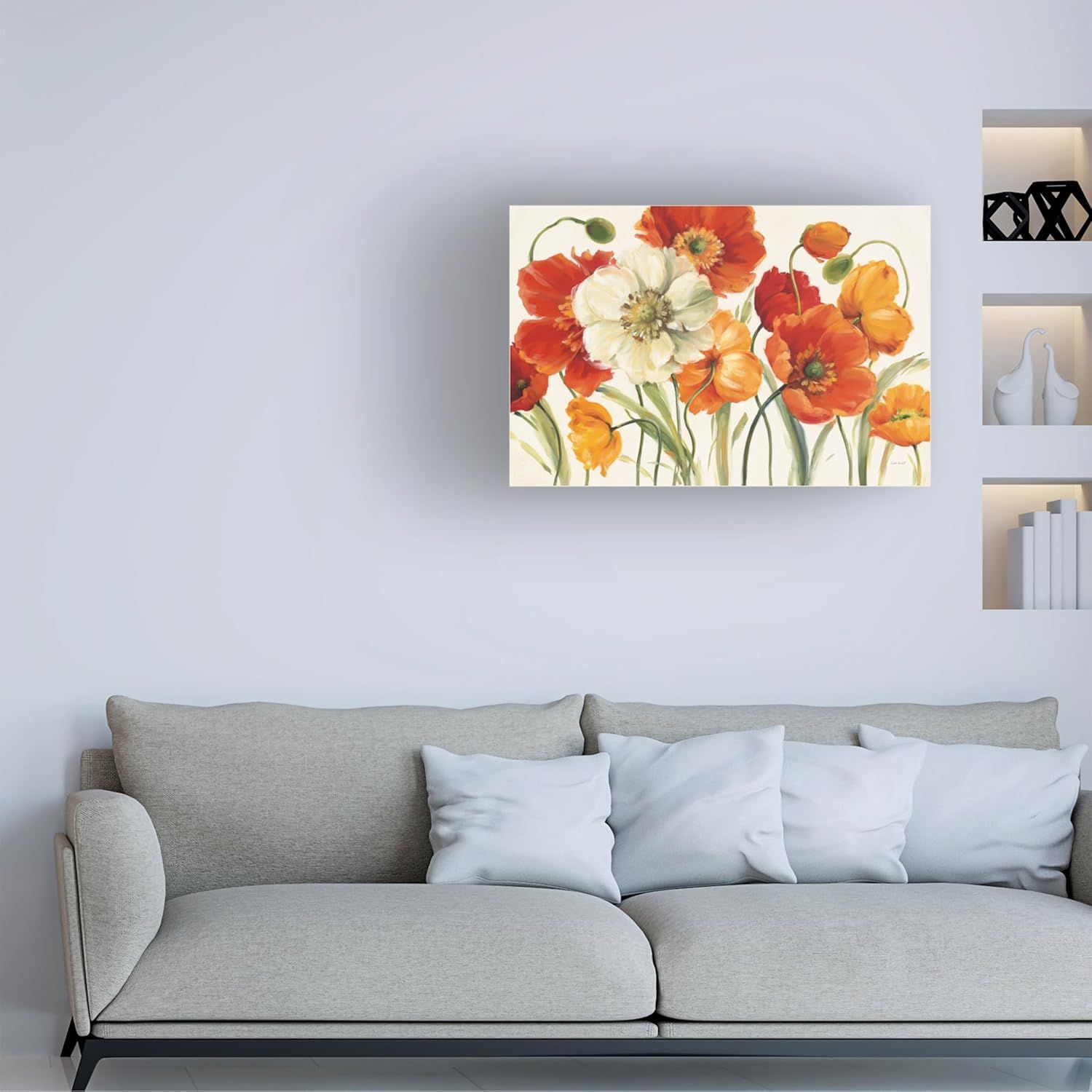 Demonstrates how the floral canvas art looks when displayed in a real living room setting, helping shoppers visualize the product in their own home.