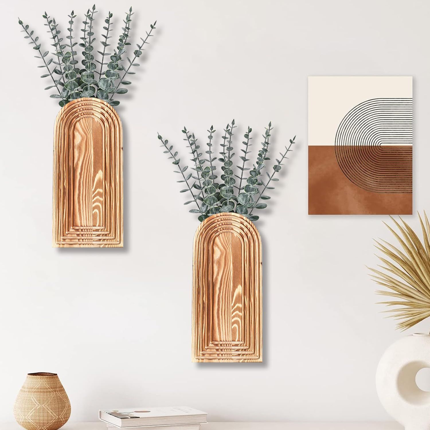 Demonstrates how the product (wooden arch-shaped wall vases) looks when styled in a real home environment, helping shoppers visualize the aesthetic appeal and placement in their own space.