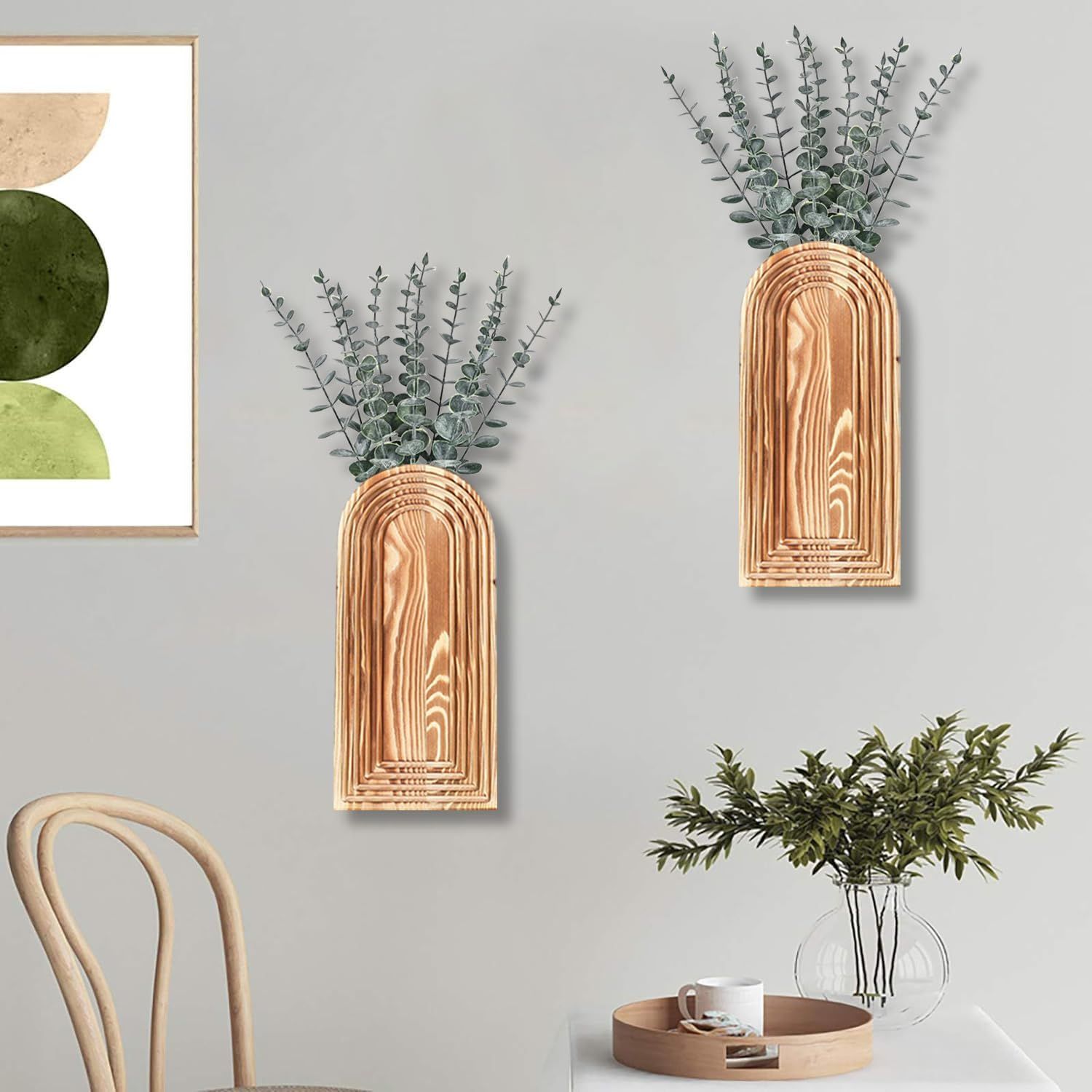 Demonstrates how the wall-mounted vases look when styled in a real home environment, helping shoppers visualize the product in their own space.