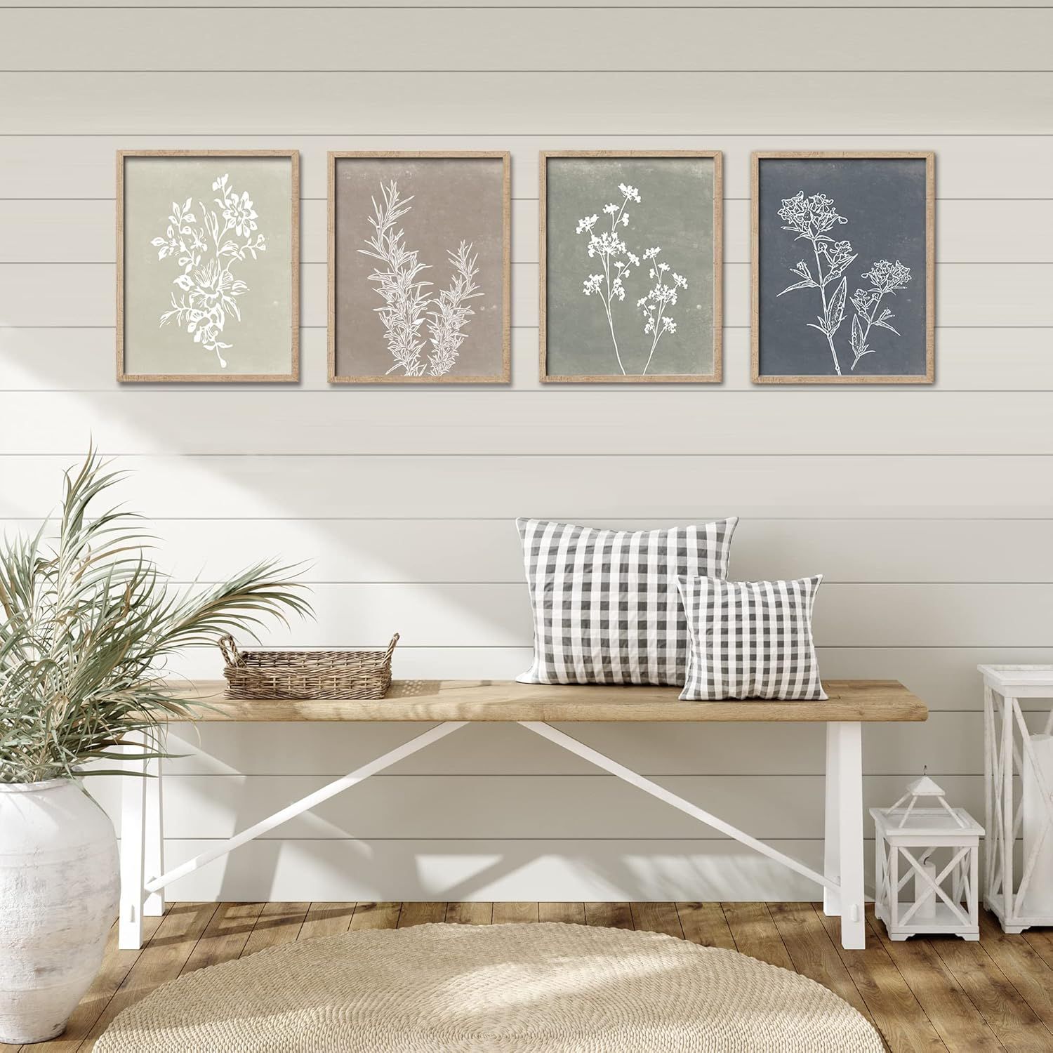 Shows the product (framed botanical prints) styled in a real-world home setting to help shoppers visualize how the artwork would look in their own space.