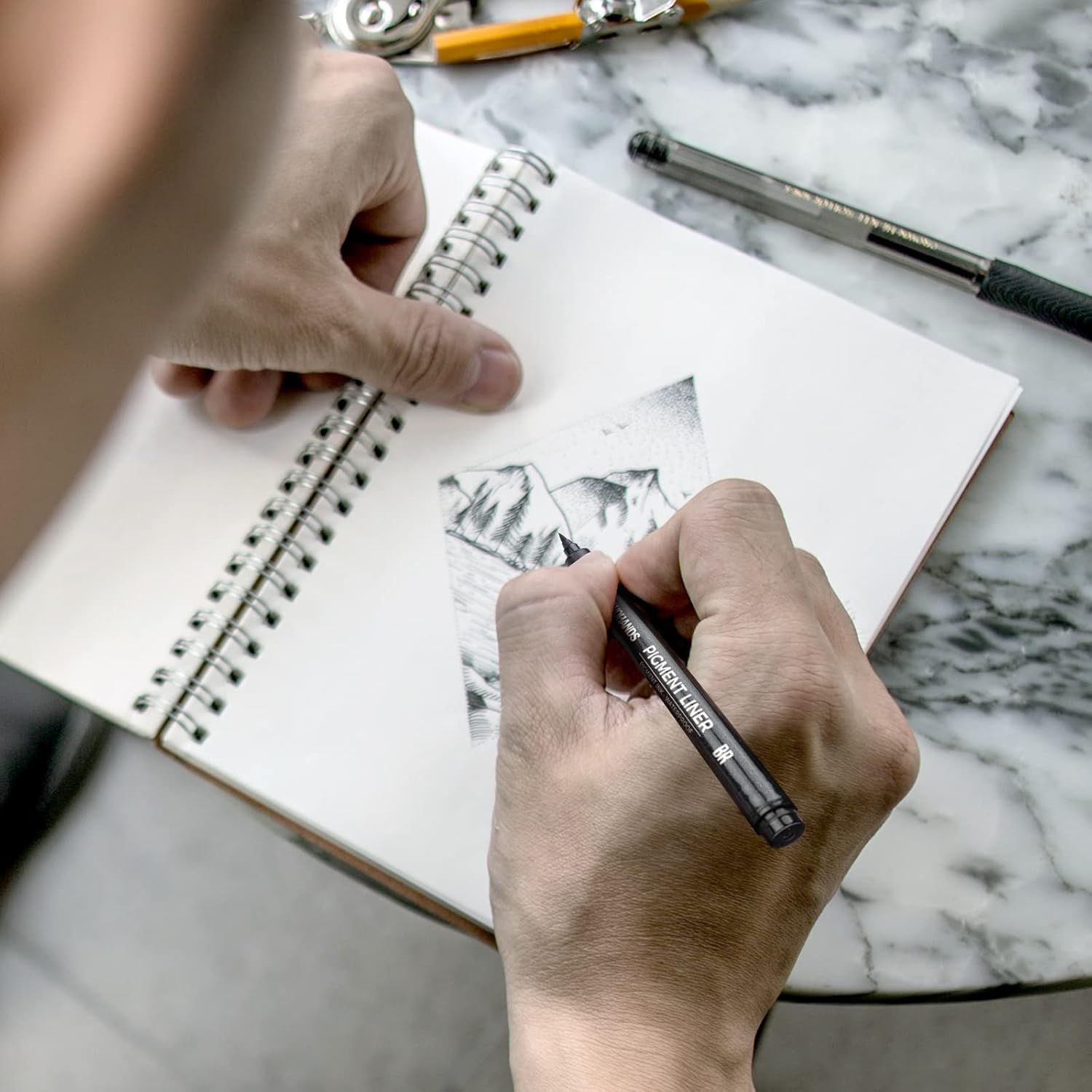 Demonstrates the product being used in a real-world creative setting to help shoppers visualize themselves using the drawing/sketching tool.