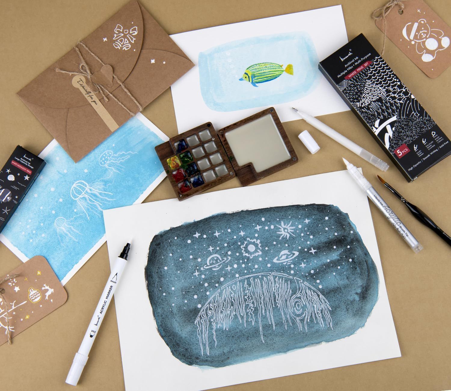 Shows everything included in the art kit to help shoppers understand the full value and contents they will receive, including paints, brushes, stencils, envelopes, and finished artwork examples.