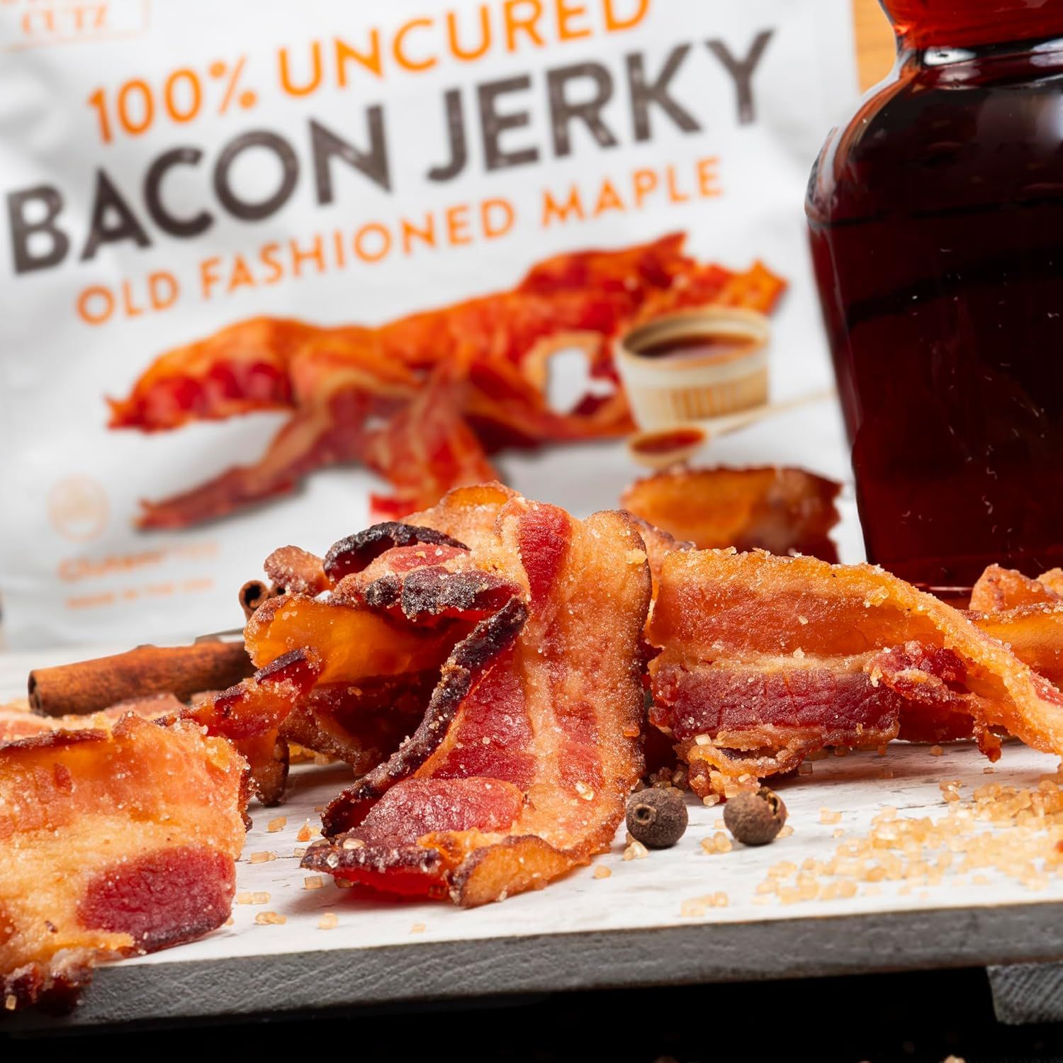 Highlights the product's natural, uncured preparation and distinctive old fashioned maple flavor to appeal to health-conscious consumers seeking premium, authentic bacon jerky.