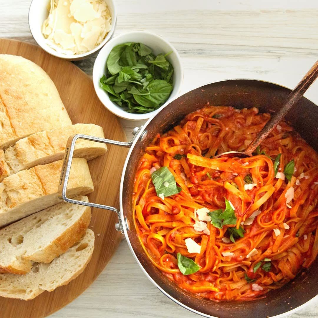 Showcases the product (pasta dish) in an authentic, appetizing real-world setting to help shoppers visualize the meal experience and inspire purchase through lifestyle appeal.