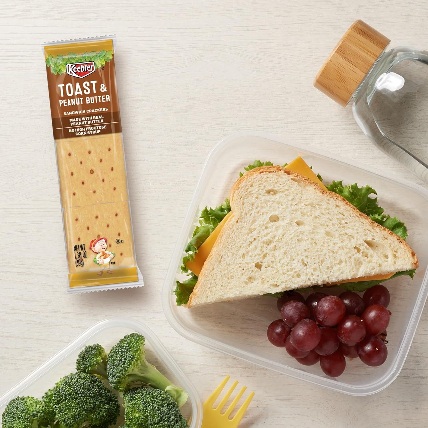 Shows the product in a real-world lunch context to help shoppers visualize how the crackers fit into everyday meal occasions and portability.