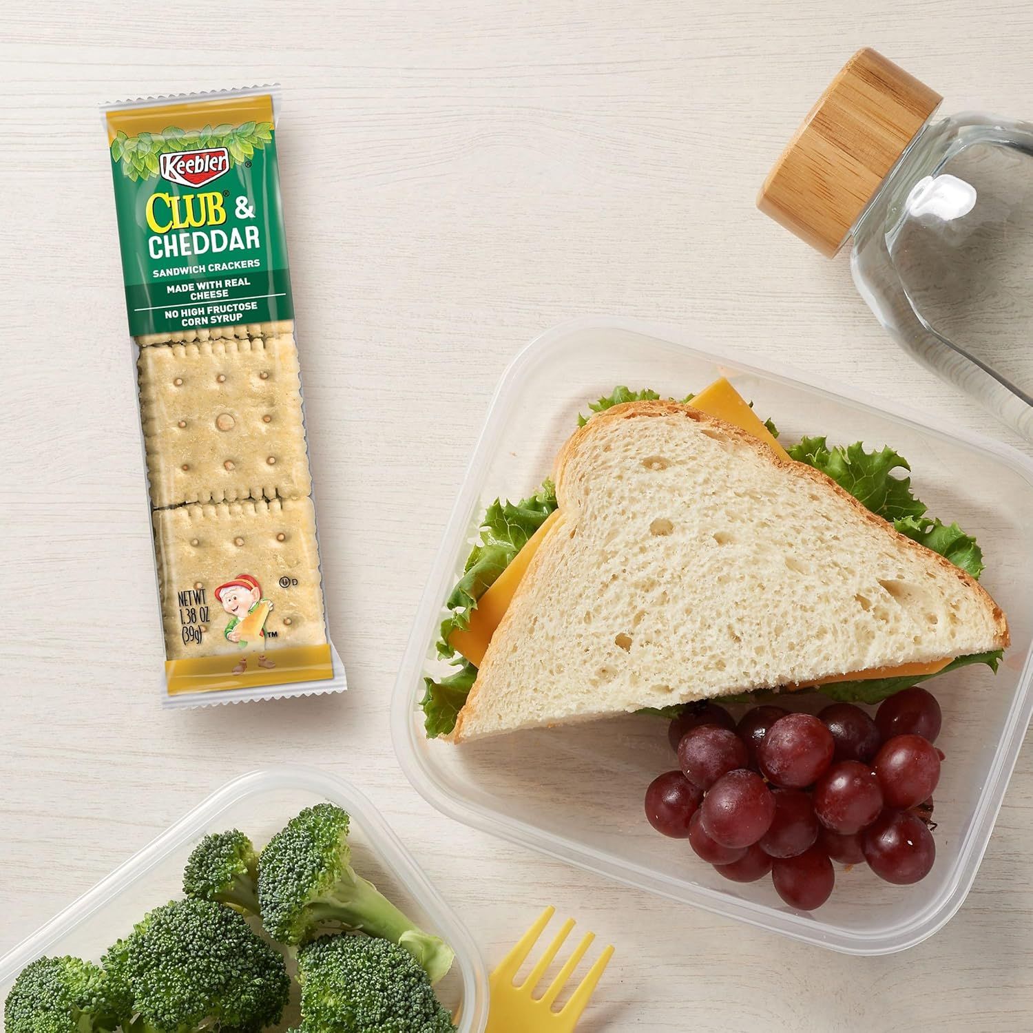 Demonstrates how the crackers fit into a complete lunch scenario, showing shoppers a practical use case for the product as part of a balanced meal.