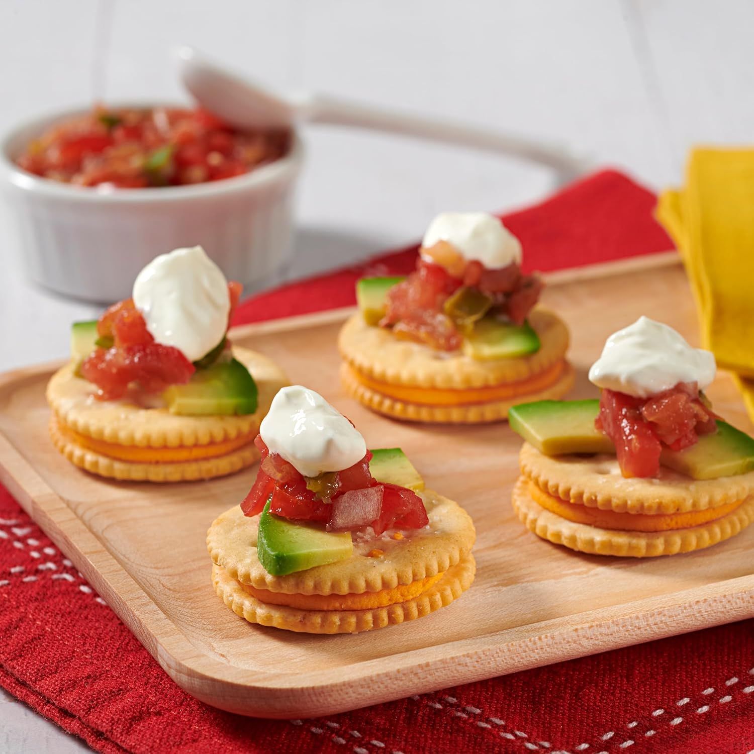 Demonstrates creative serving ideas and recipe applications for the product, showing shoppers how to use the crackers as a base for appetizers or snacks.