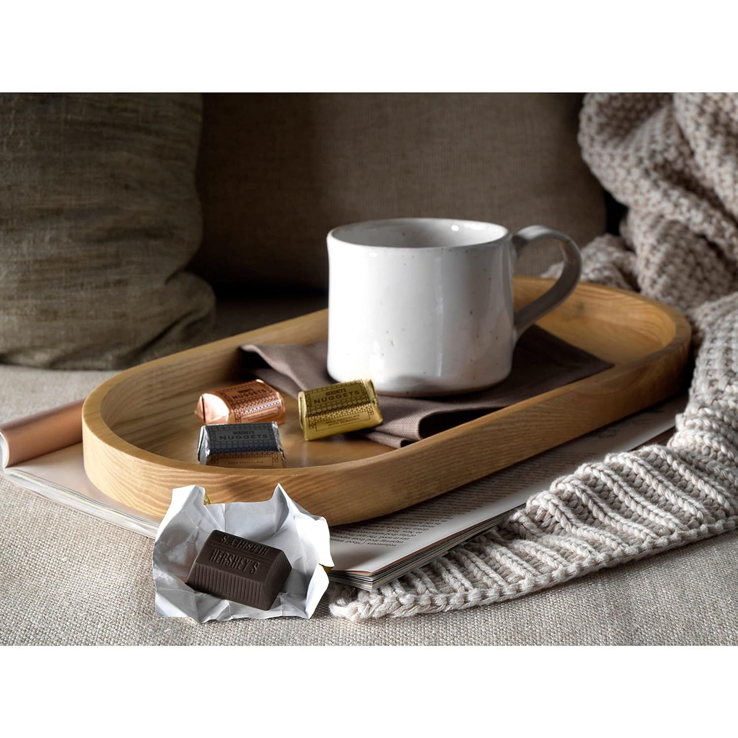 Creates an emotional connection by showing the product in a warm, inviting lifestyle context that suggests comfort and relaxation.