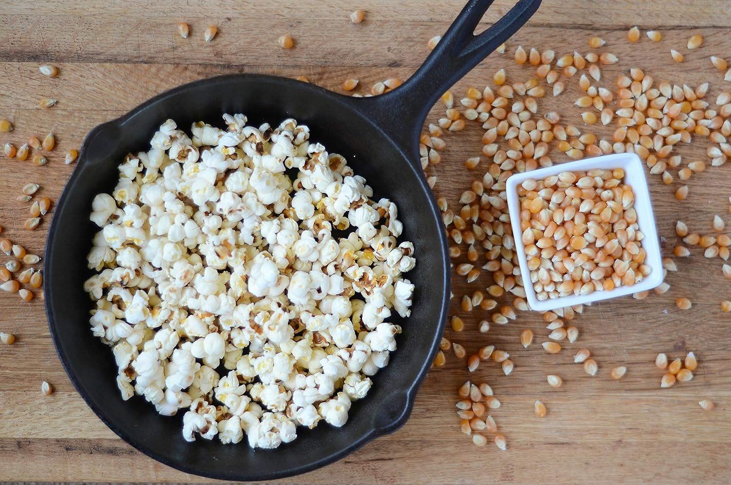 Demonstrates the product's effectiveness by showing the transformation from unpopped corn kernels to fully popped popcorn, proving the quality and yield of the product.
