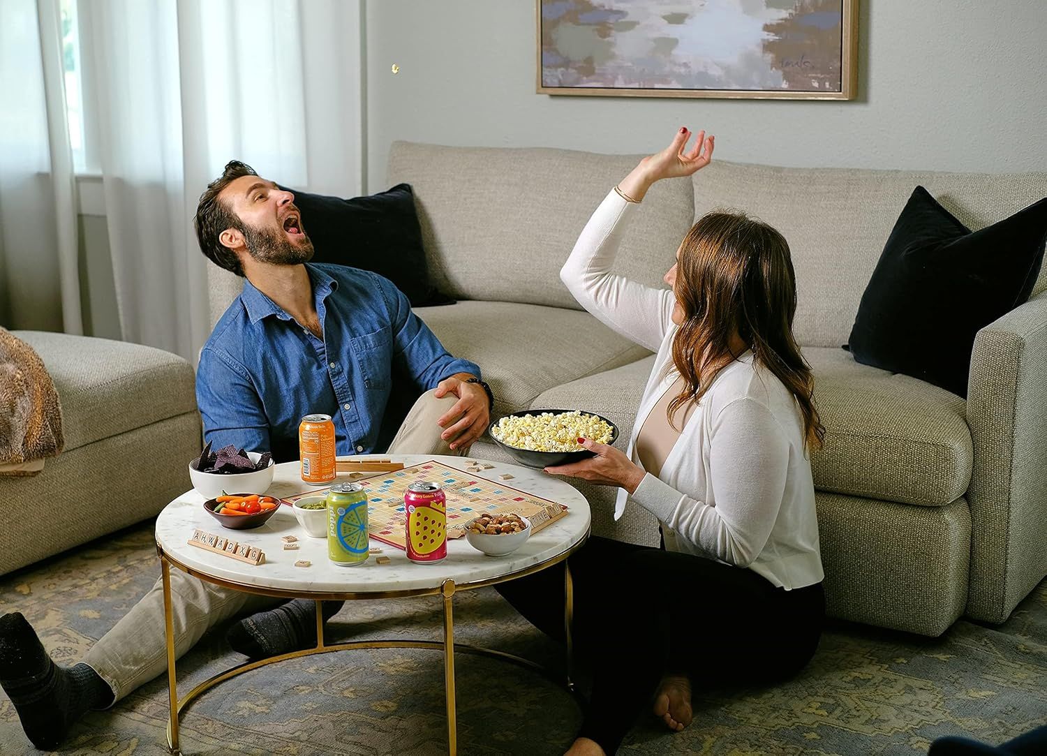 Demonstrates the product in a real-world home setting to help shoppers visualize using it during casual entertainment and social moments with family or friends.