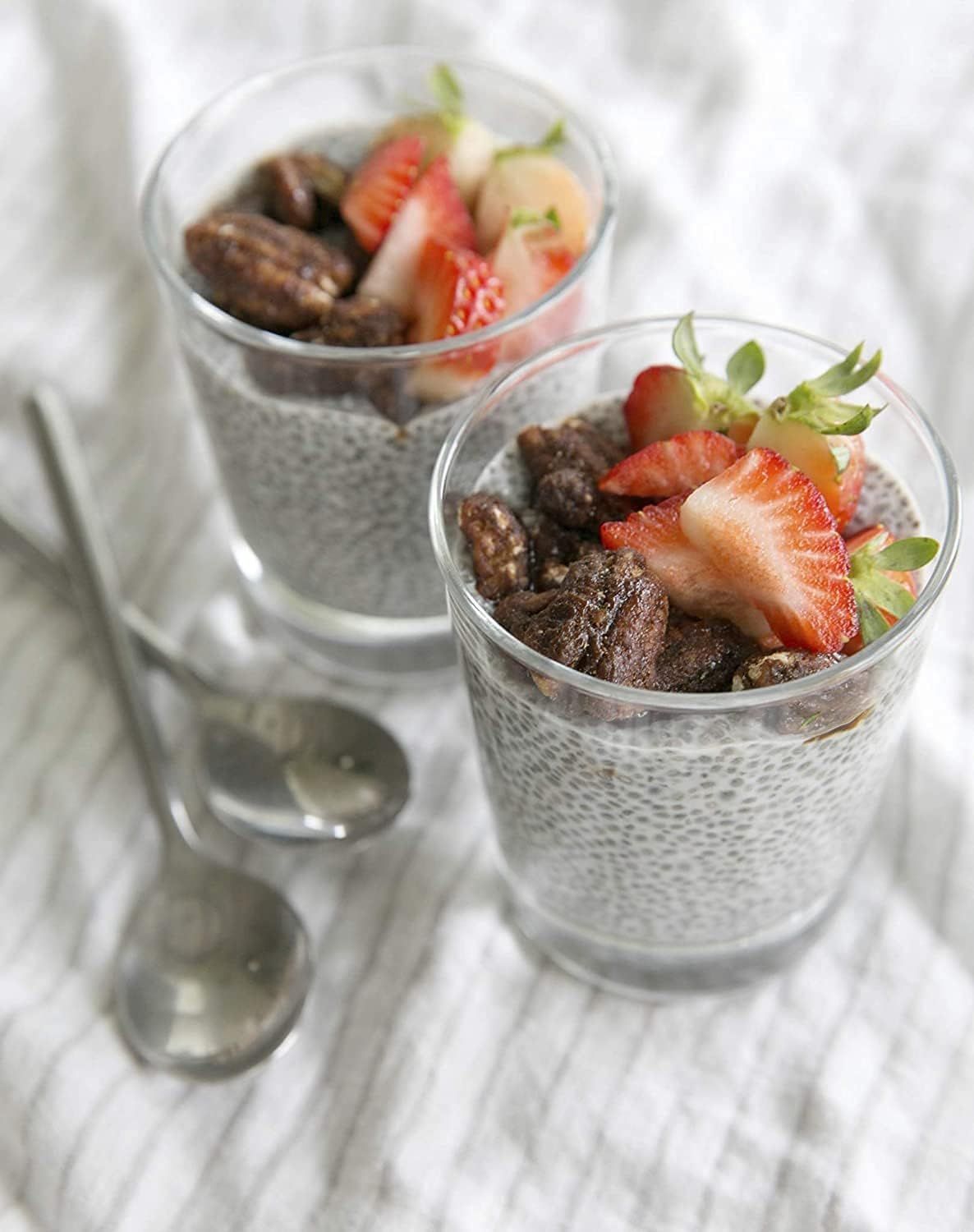 Showcases the product (chia pudding) in an appealing, real-world context to help shoppers visualize the finished result and inspire usage.