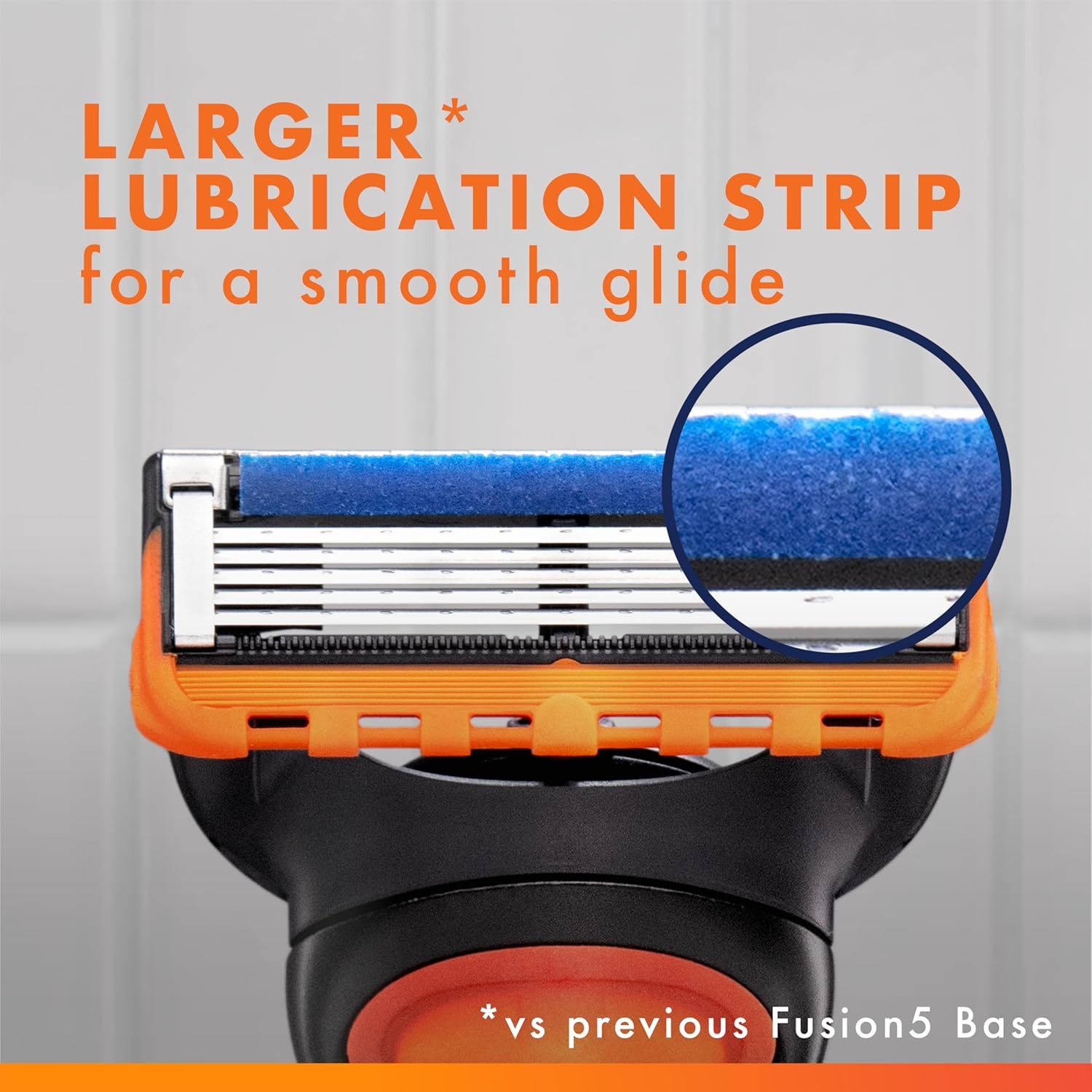 Highlights the enhanced lubrication strip feature of the razor blade, emphasizing its larger size compared to the previous model for a smoother, more comfortable shave. Communicates the primary…