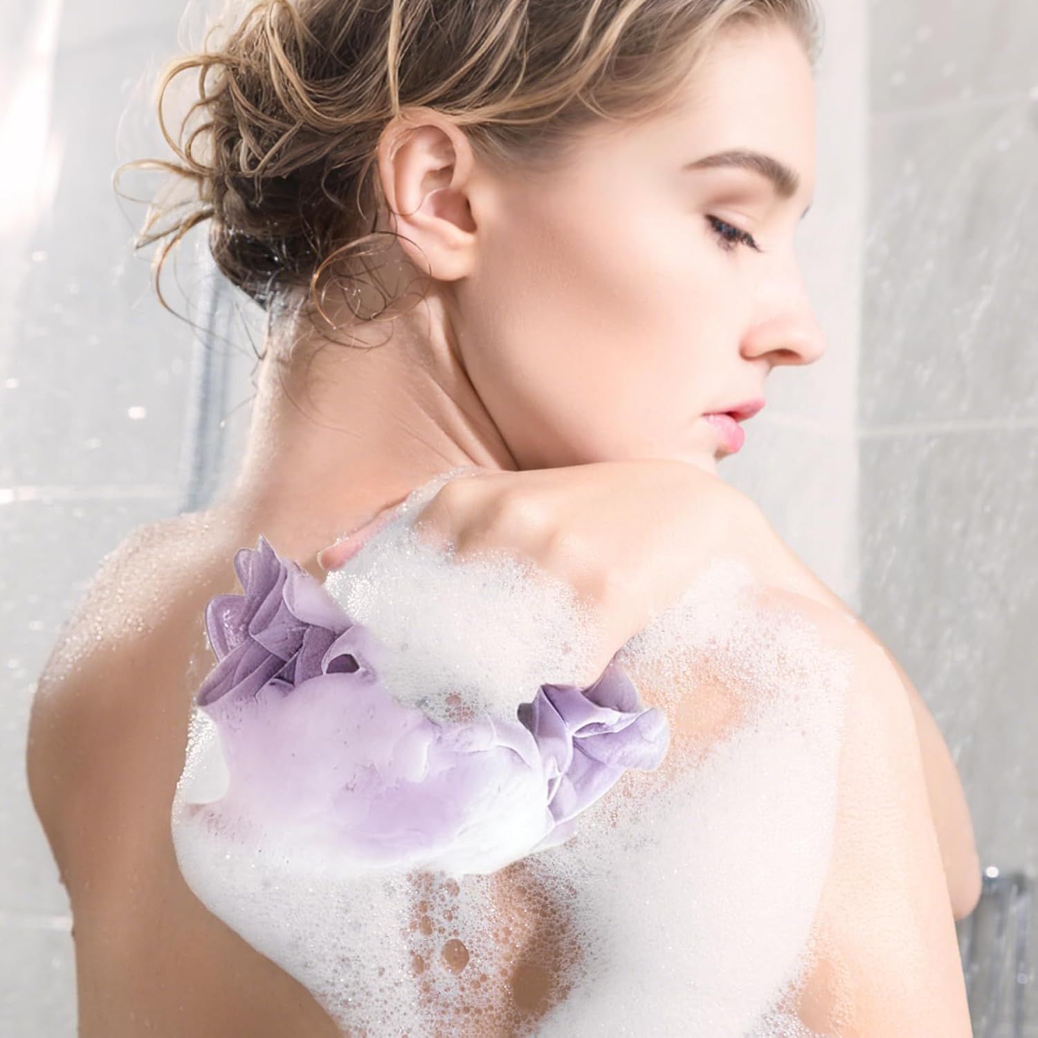 Demonstrates the product in a real-world bathing context, showing the rich lather and luxurious experience to help shoppers visualize using the product.