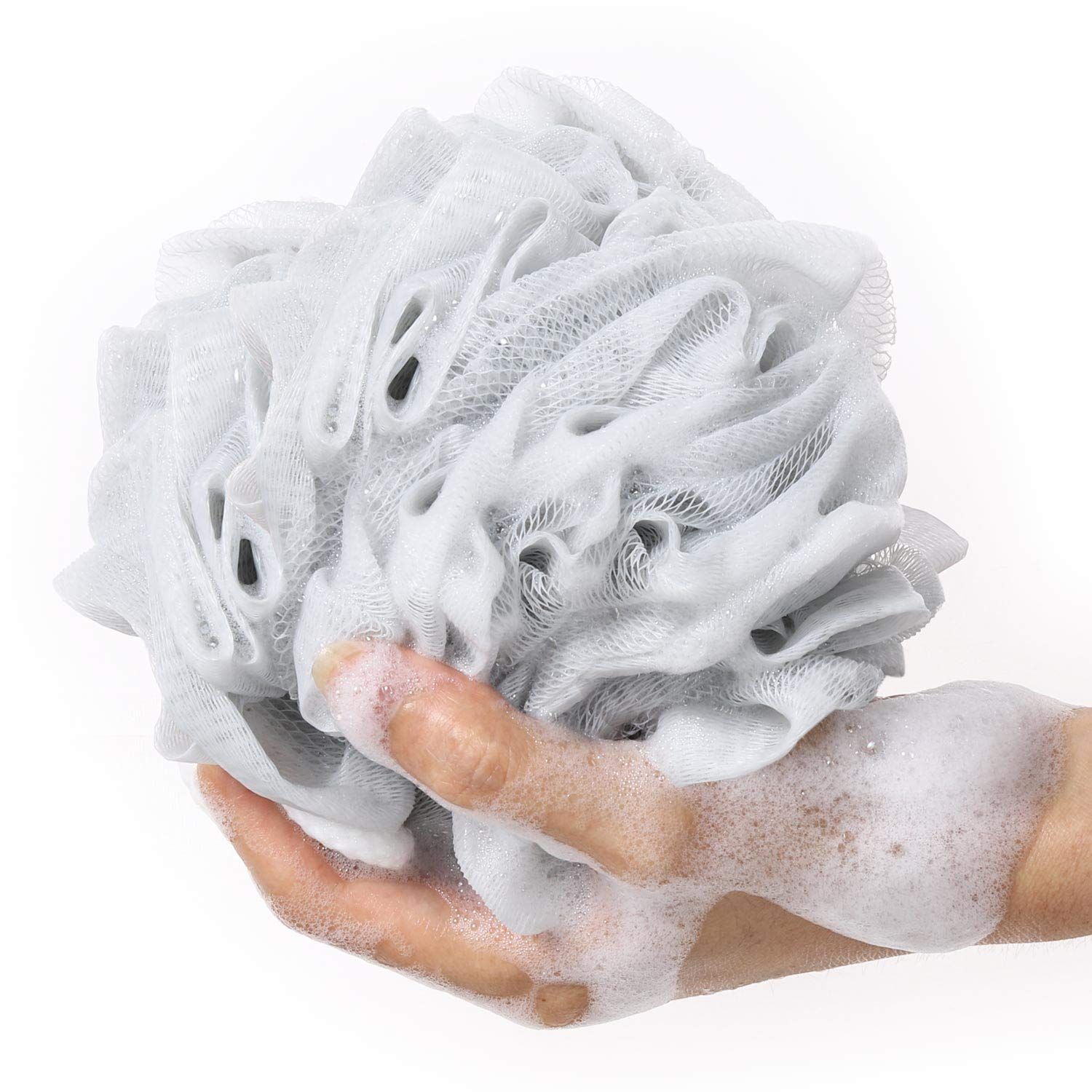 Demonstrates the product in real-world use with hands holding the lathered loofah, showing shoppers how the product performs and creates rich foam during bathing.
