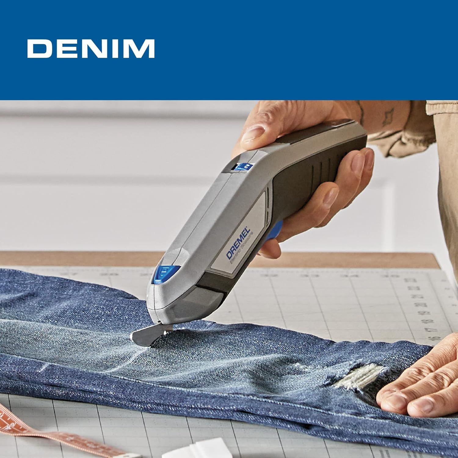 Demonstrates the product's ability to cut through denim fabric, showing a practical use case for crafters and sewers.
