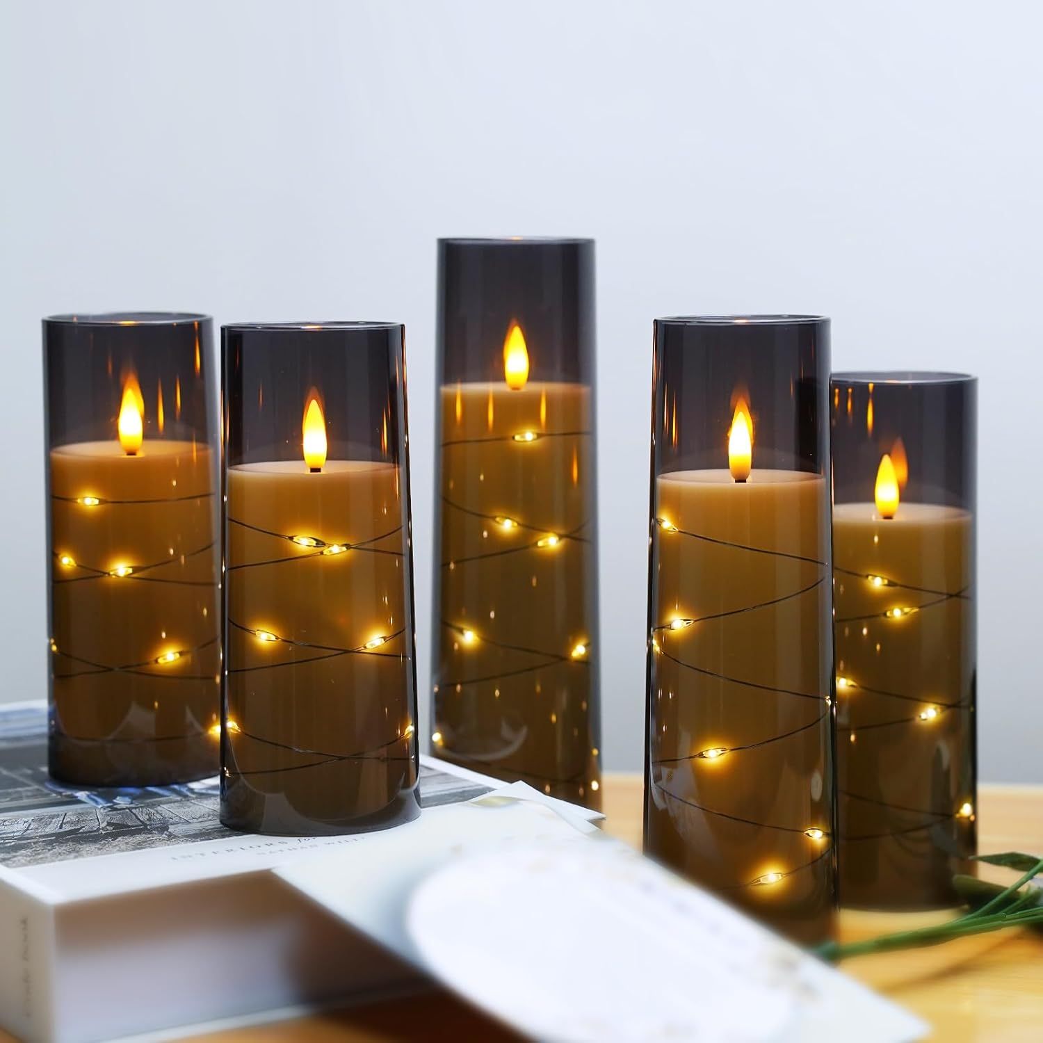 Showcases the product in a real-world home setting to help shoppers visualize how the LED candles create warm, decorative ambiance in their own space.