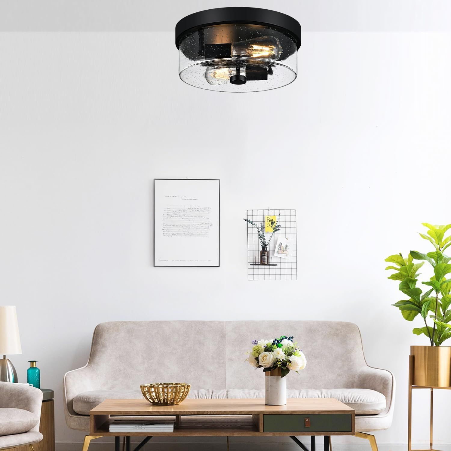 Demonstrates how the ceiling light fixture looks when installed in a real living room environment, helping shoppers visualize the product in their own home.