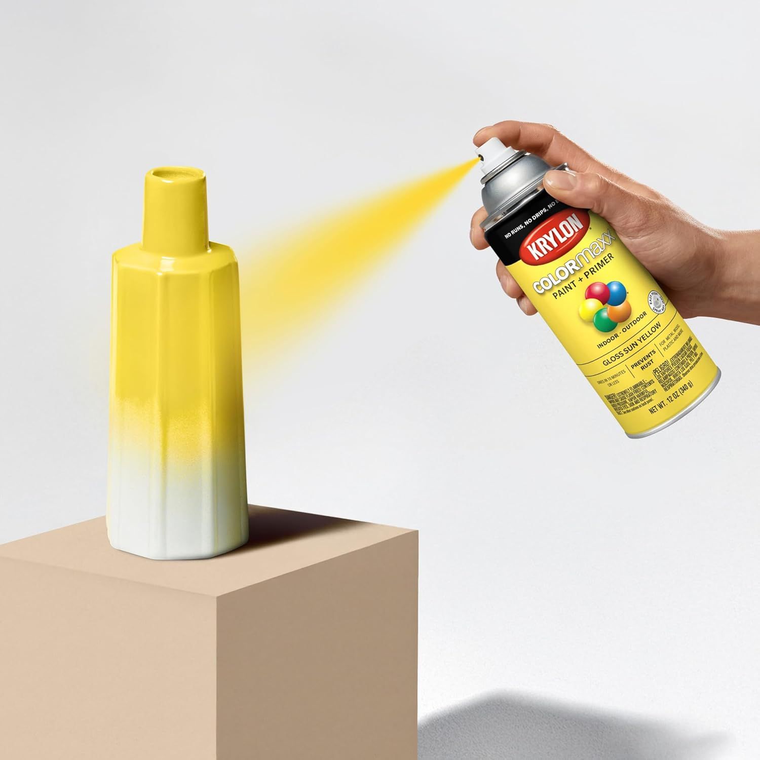 Demonstrates how to use the spray paint product by showing proper hand positioning and spraying technique on an object, helping shoppers understand the application method. Shows the ease of use and…