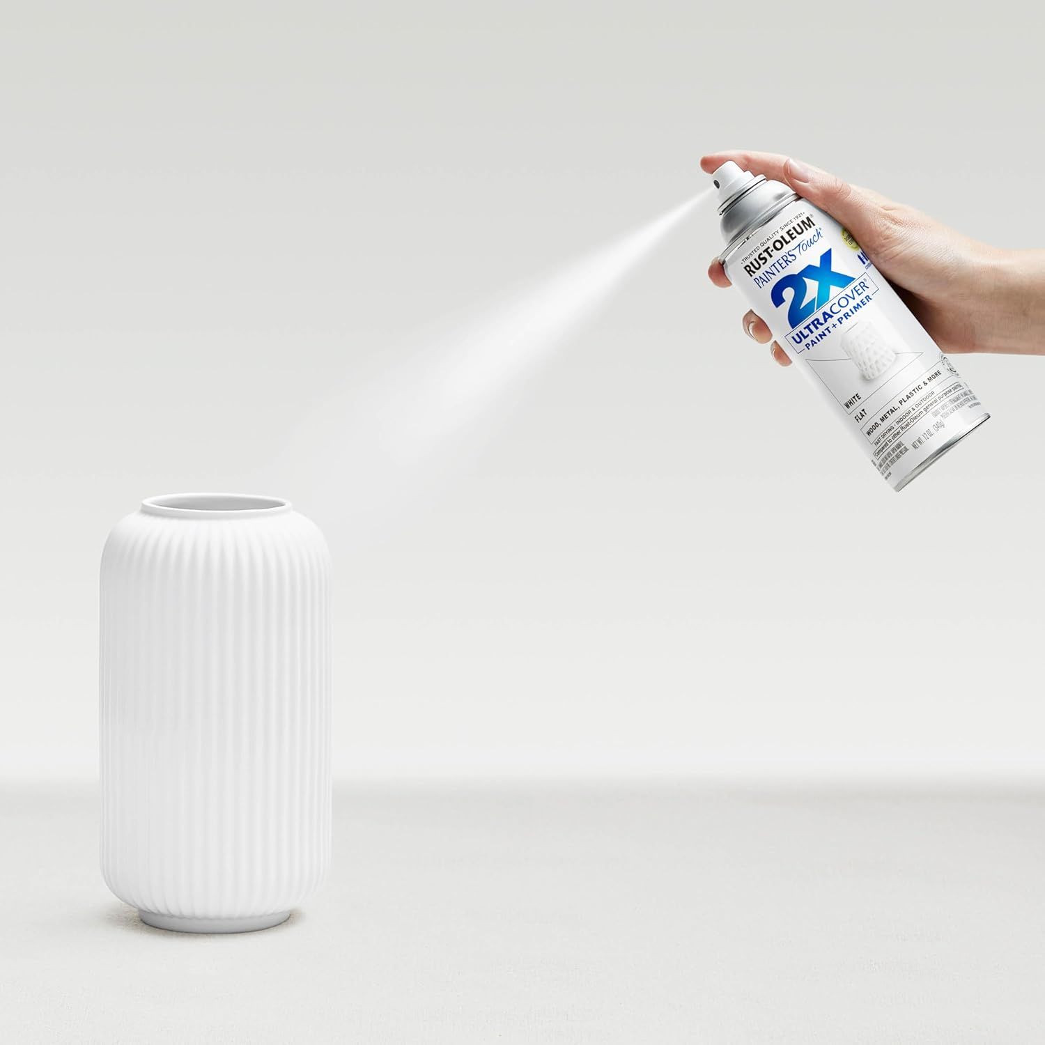 Demonstrates the product being used in a real-world setting to help shoppers visualize how they would use the spray paint on home decor items.