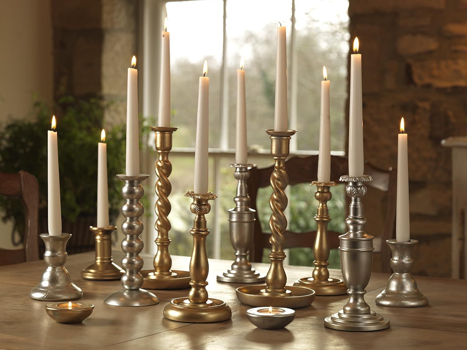 Showcases the candle holders in an elegant, real-world home setting to help shoppers visualize how the product collection would look styled in their own space.