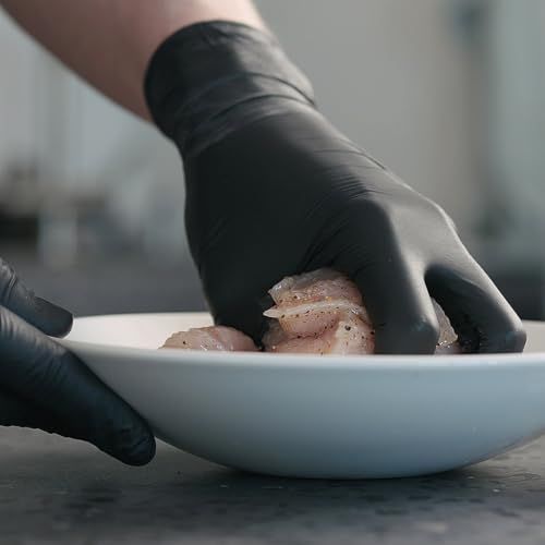 Demonstrates the product (gloves) in a real-world culinary context, showing hands-on food handling to communicate practical application and professional quality.