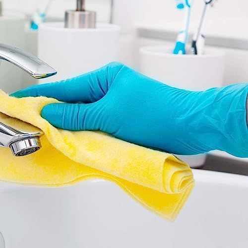 Demonstrates the product in a real-world cleaning scenario to show shoppers how the gloves can be used for household cleaning tasks.