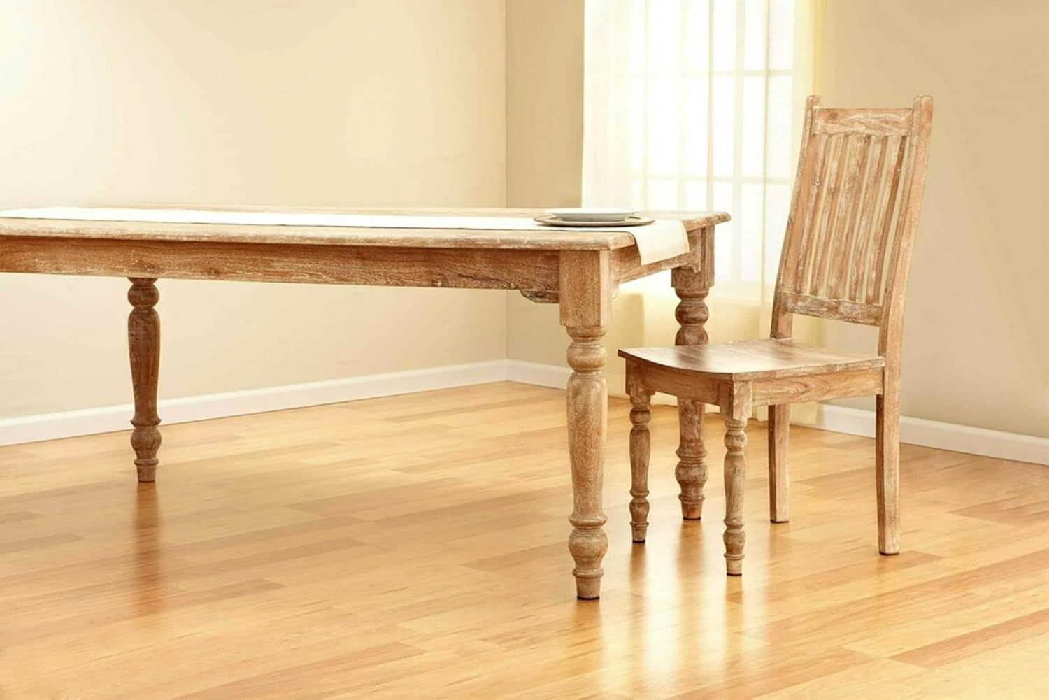 Showcases the product in a real-world dining room environment to help shoppers visualize how the furniture would look in their own home.