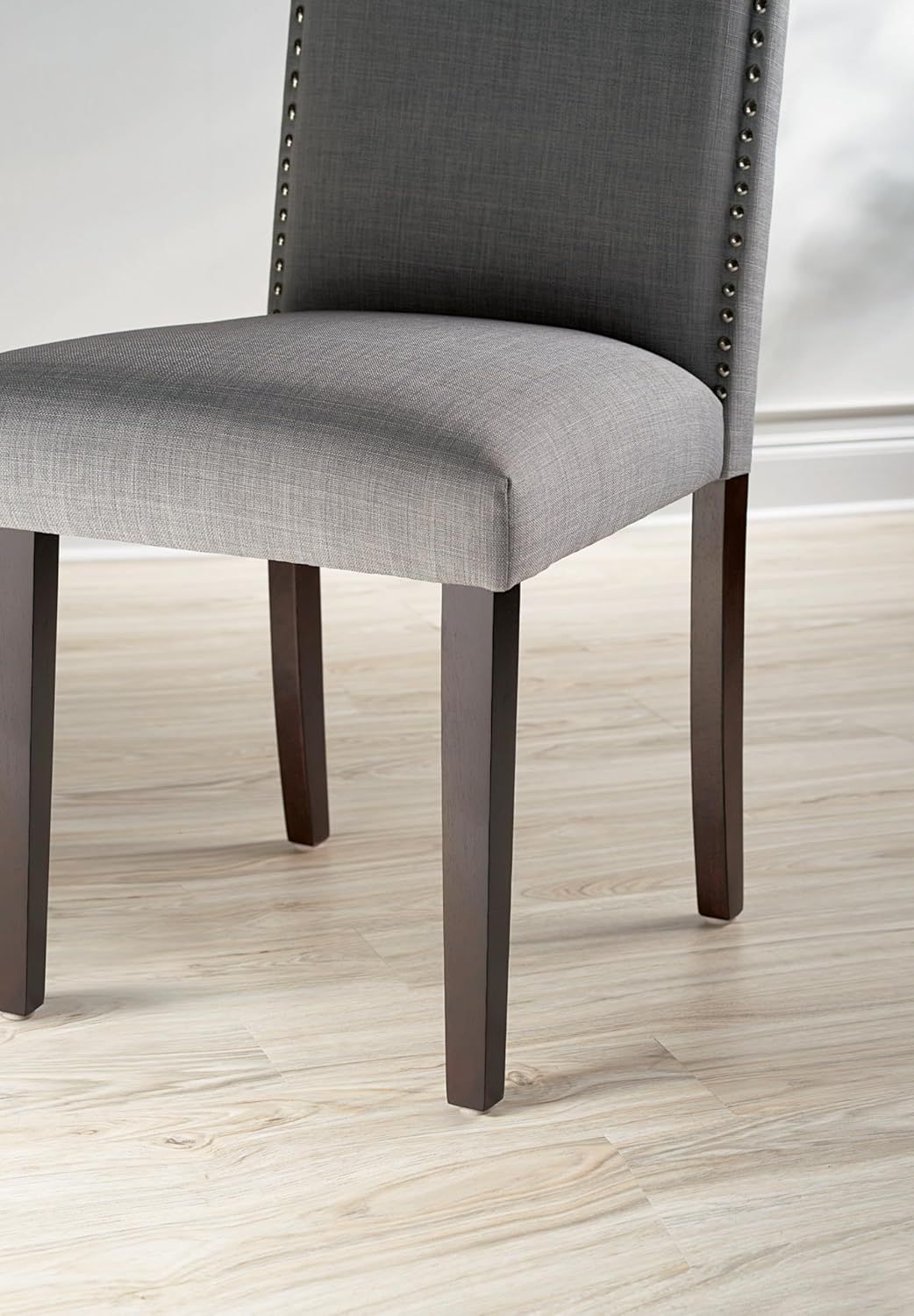 Showcases the product in a real-world home environment to help shoppers visualize how the chair would look in their own space.