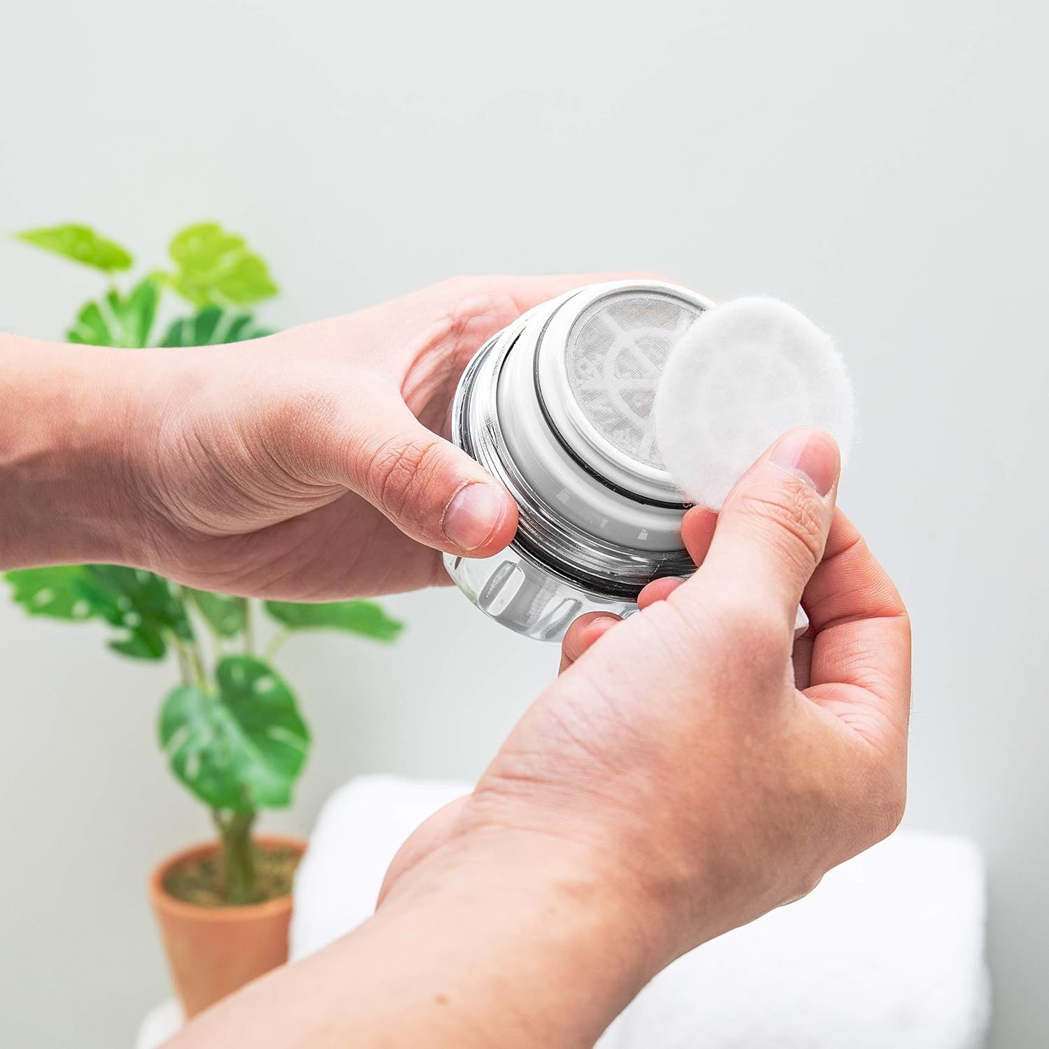 Demonstrates how to open or access the product, showing the simple twist-off mechanism to reassure shoppers about ease of use. Highlights the straightforward, accessible design of the product in a…