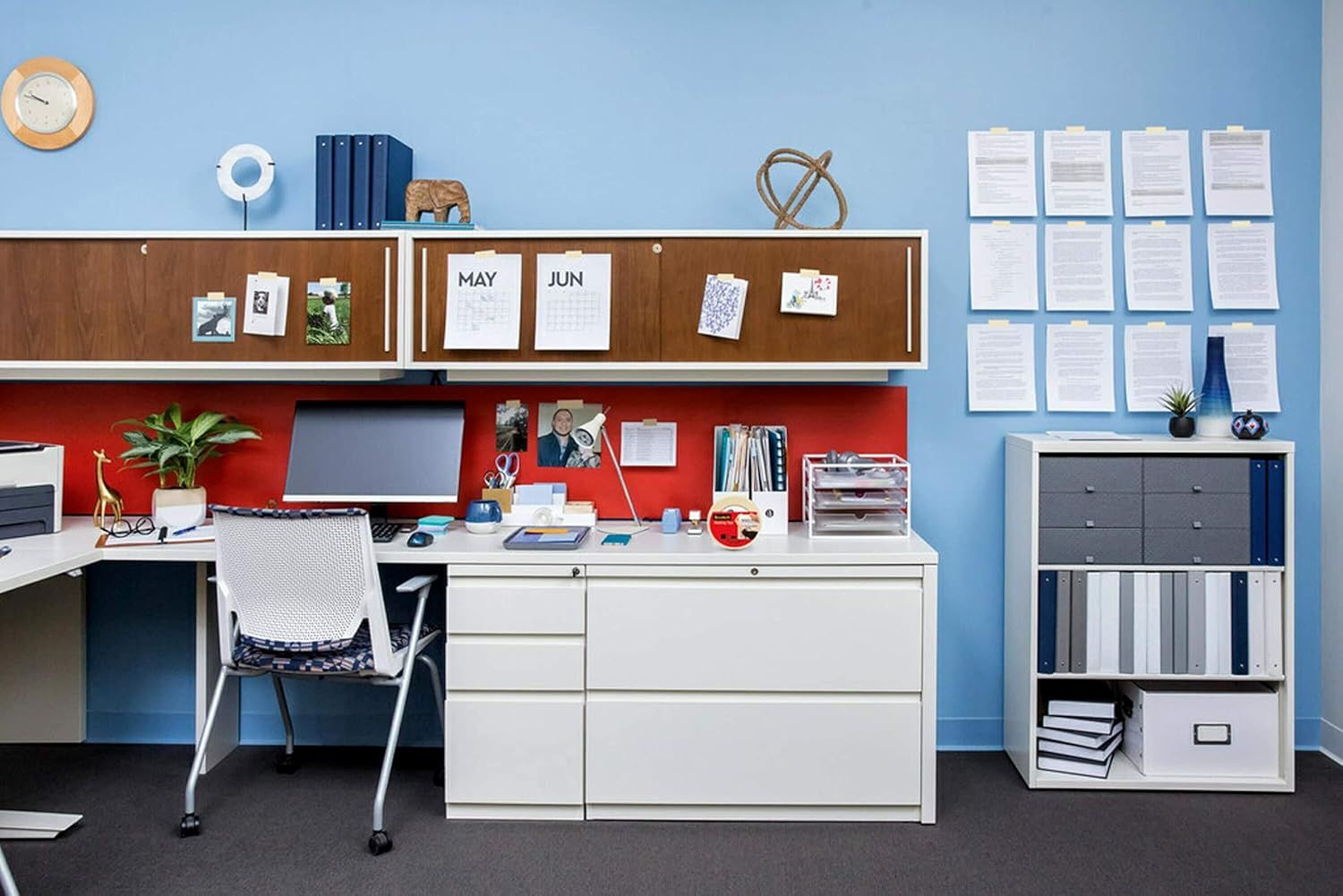 Demonstrates the product in a real-world office environment to help shoppers visualize how the furniture and organizational products work together in an actual workspace setting.