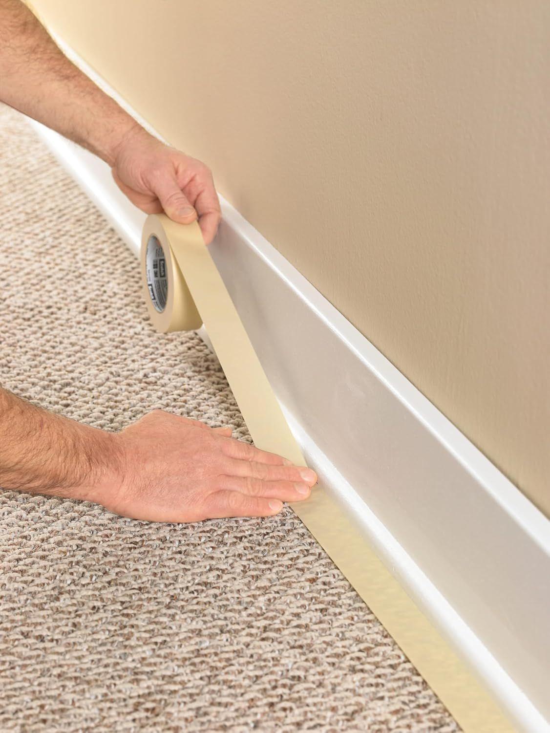 Demonstrates how simple it is to install the product by showing hands applying tape along the baseboard, reassuring shoppers that installation requires no special tools or expertise. Highlights the…