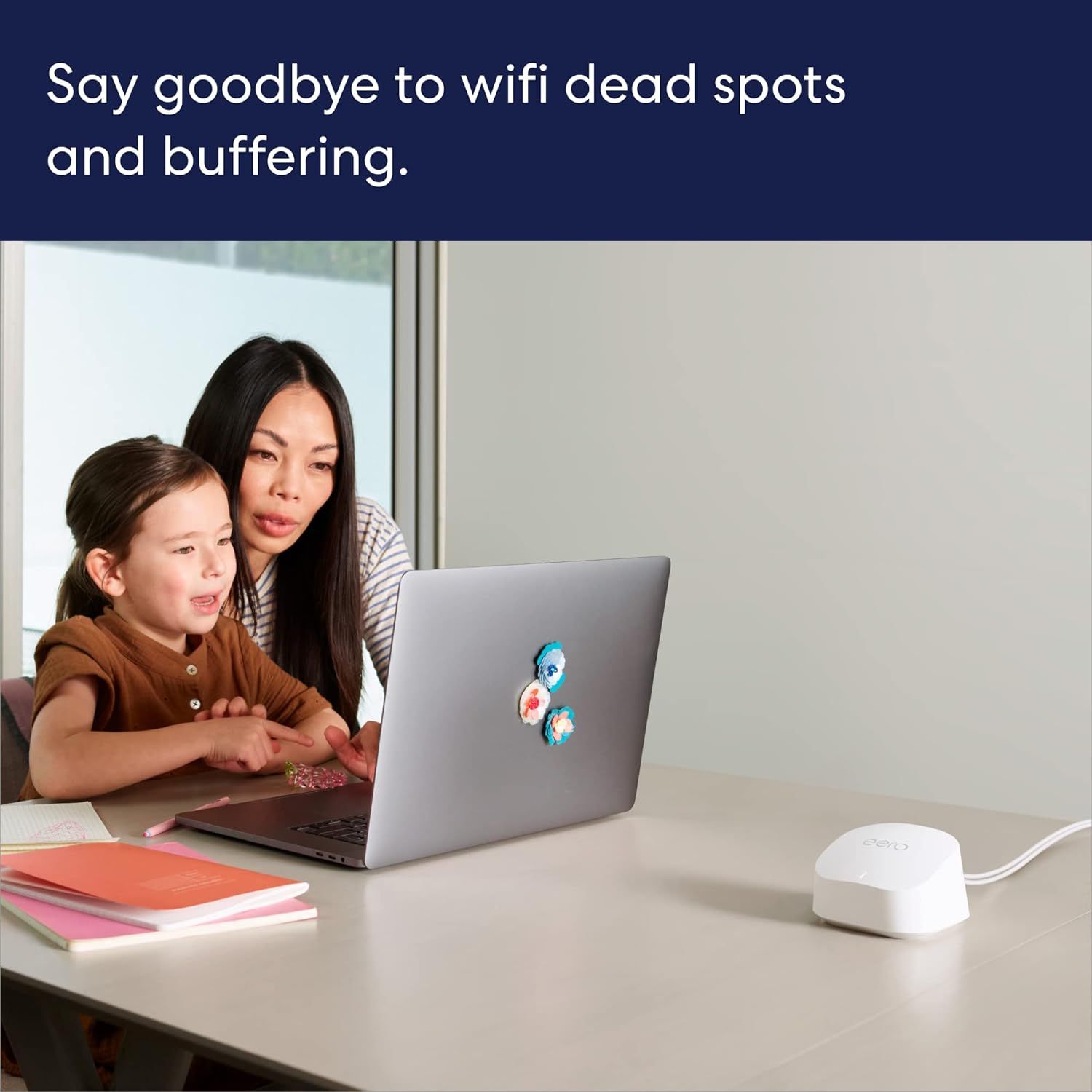 Communicates that the product solves connectivity problems by eliminating WiFi dead spots and buffering, showing a real-world home use scenario with a parent and child using a laptop smoothly.