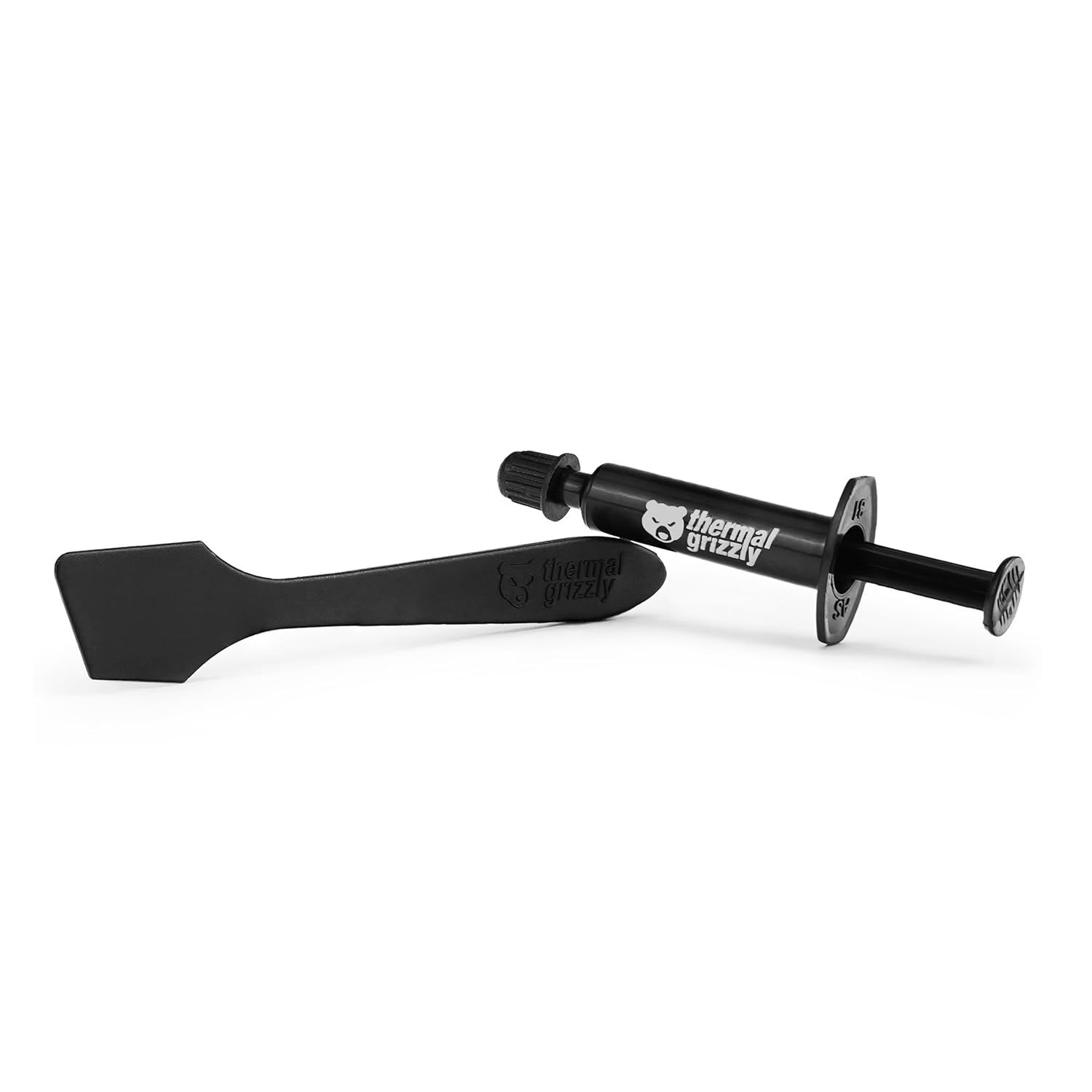 Provides a clean, catalog-style view of the thermal paste applicator and spatula on a white background with no distractions, allowing shoppers to see the product clearly.