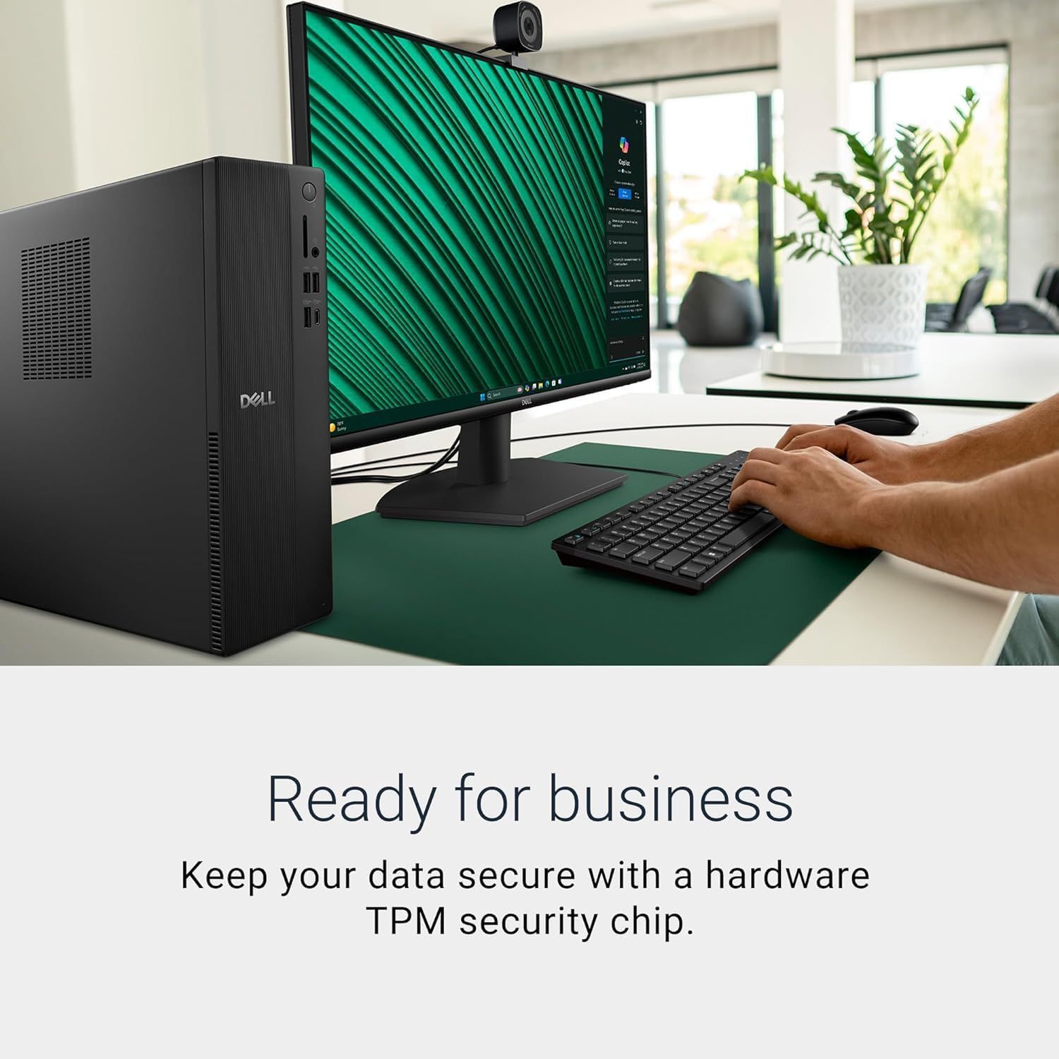 Communicates that the Dell computer system is designed for business use with built-in data security through a hardware TPM security chip, reassuring business customers about data protection.