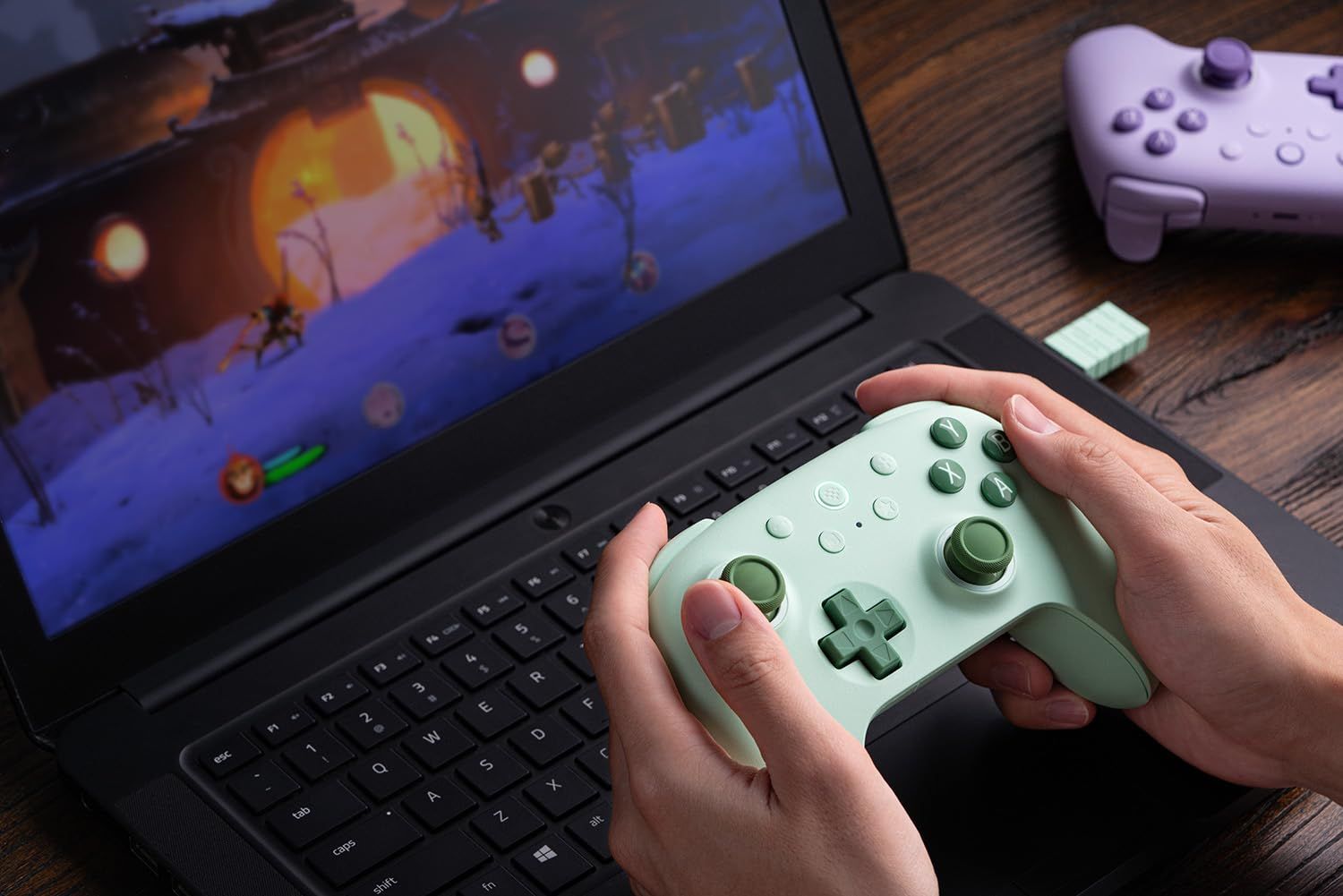 Shows the product being used in a real-world gaming environment to help shoppers visualize how the controller fits into their lifestyle and gaming setup.