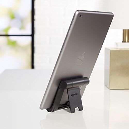 Demonstrates the product (tablet stand) in a real-world home or office setting to help shoppers visualize how it would look and function in their own space.
