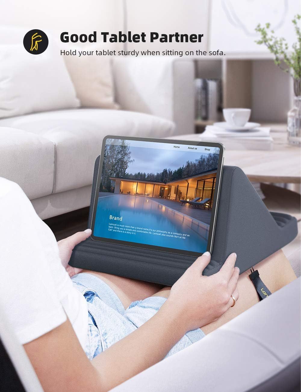 Demonstrates that the tablet stand provides a sturdy, comfortable viewing angle when sitting on the sofa, solving the problem of holding a tablet for extended periods.