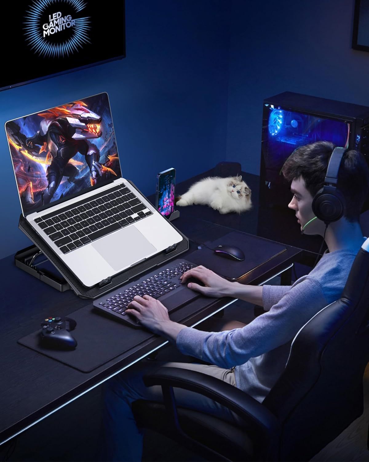 Demonstrates the product (laptop cooling stand) in a real-world gaming environment to help shoppers visualize how it fits into their lifestyle and gaming setup.