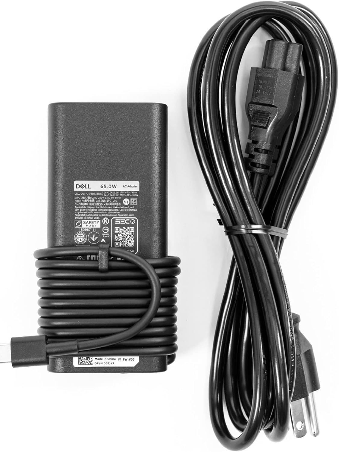 Shows the customer everything included in the package: the Dell 65W AC adapter and power cable, reassuring them they receive a complete charging solution.
