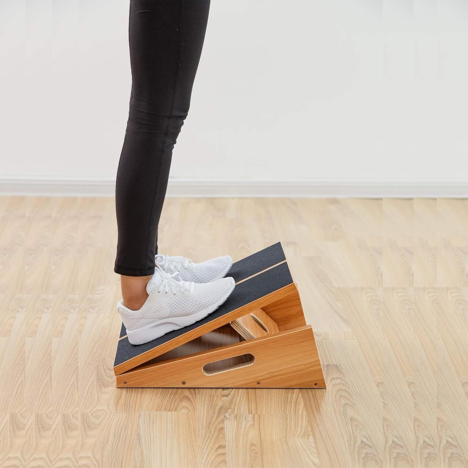 Demonstrates the product being used in a real-world setting to show shoppers how the calf stretcher integrates into everyday exercise or stretching routines.