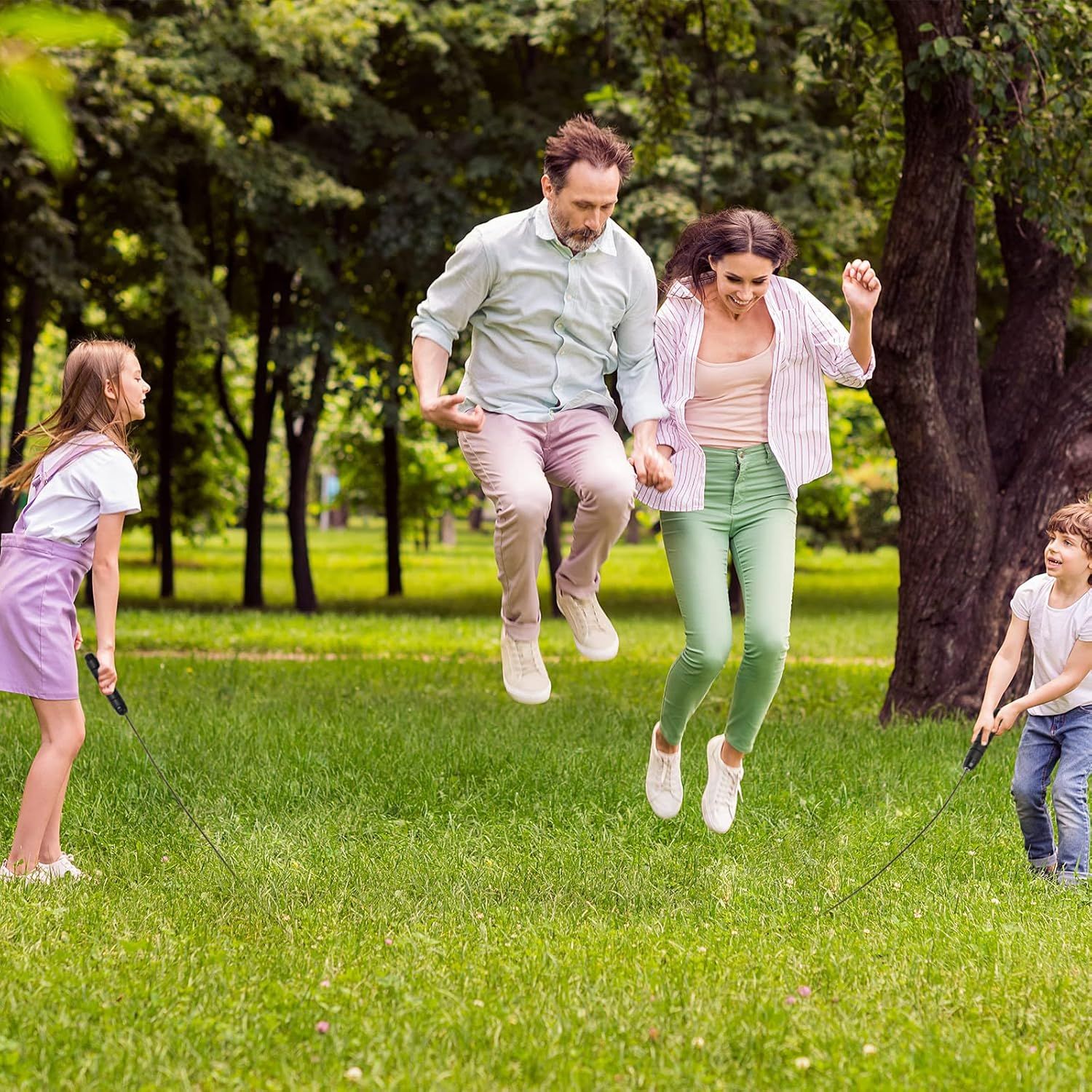 Demonstrates the product in use within a real-world outdoor family setting, showing parents and children enjoying active play together in a park environment.