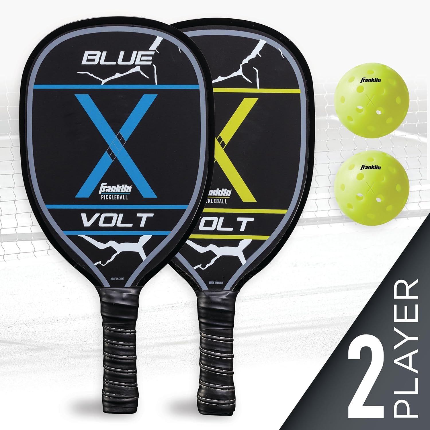 Shows everything included in the package: two pickleball paddles in different colors (blue and yellow) and two Franklin pickleballs, communicating the complete ready-to-play set for two players.