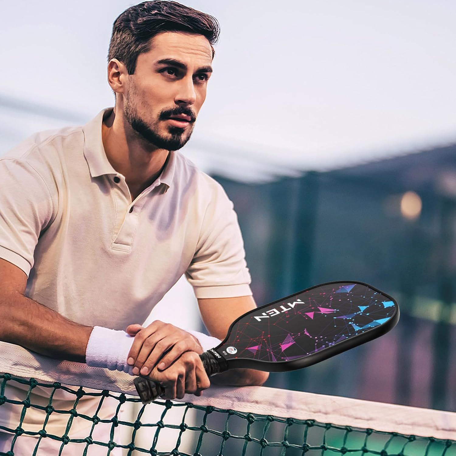 Showcases the product (paddle) in a real-world sports setting to help shoppers visualize themselves using it during play.