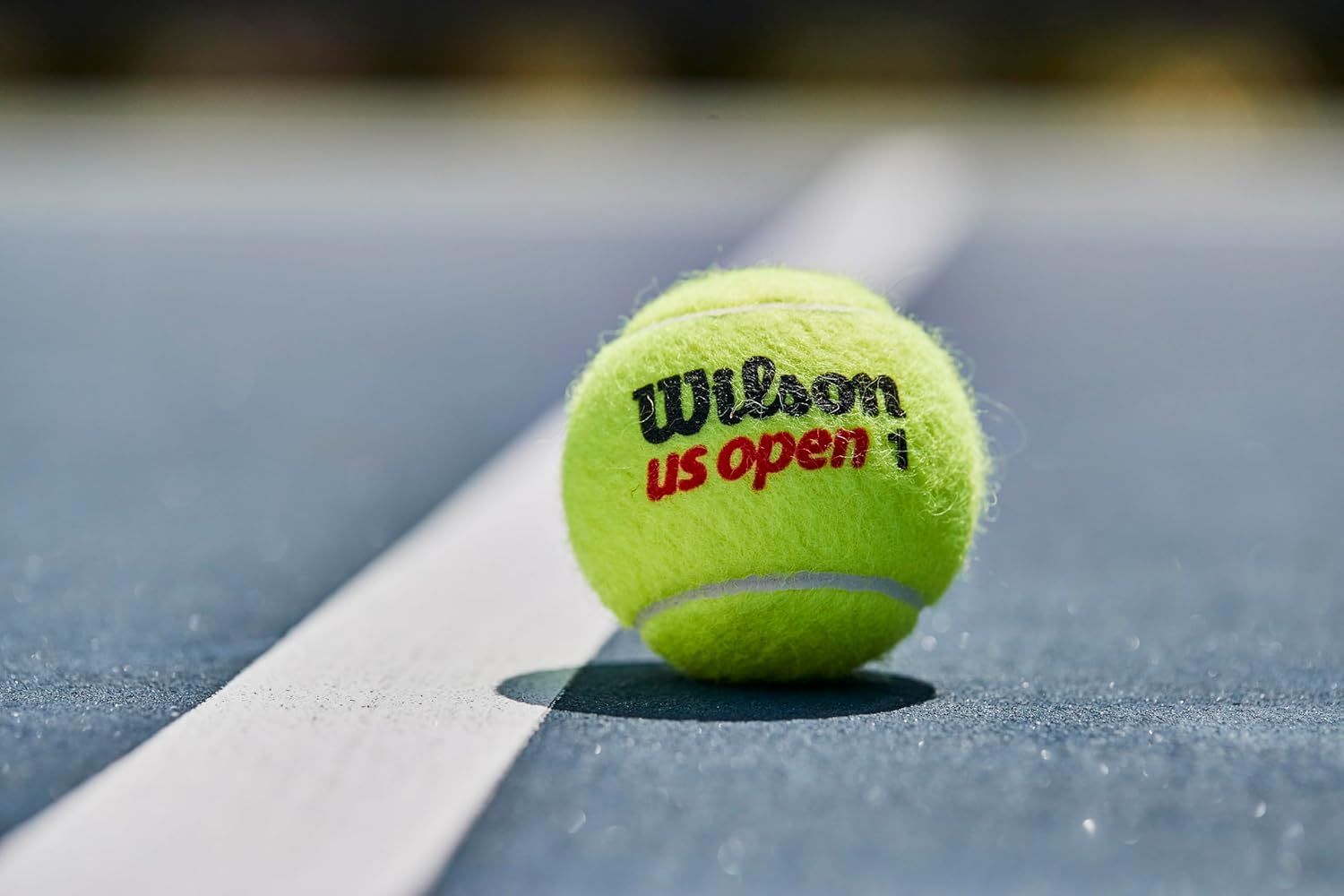 Shows the product in its real-world context on a tennis court to help shoppers visualize the product in action and connect with the sport.