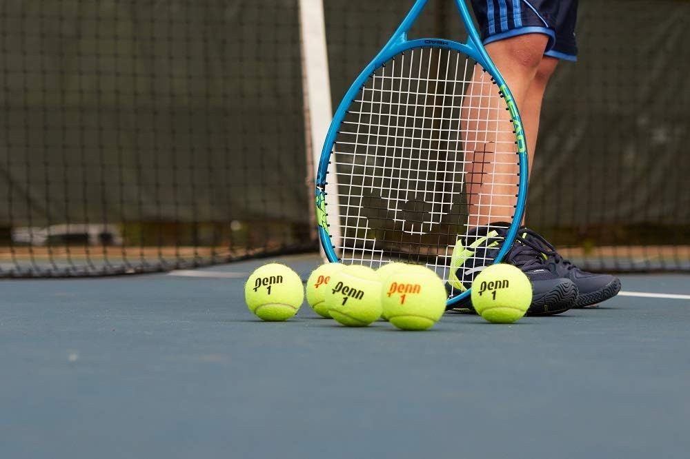 Shows the product in a real-world tennis environment to help shoppers visualize the tennis balls and racket in actual use on the court.