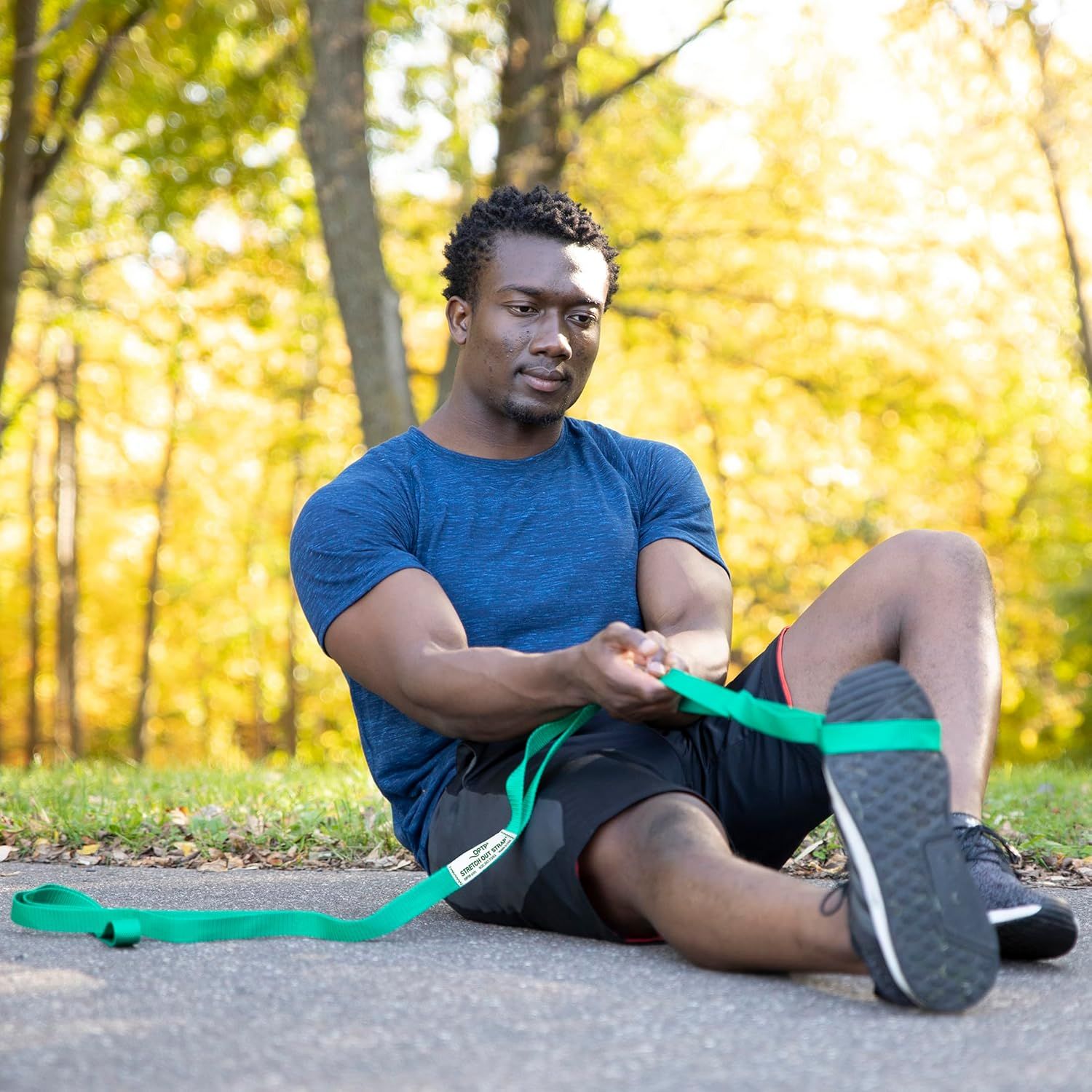 Demonstrates the product being used in a real-world outdoor fitness context to help shoppers visualize themselves using the resistance band in their own workout routine.