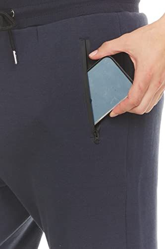Demonstrates the functional zippered pocket that securely holds a phone or valuables, reassuring shoppers about storage convenience and security during activity.