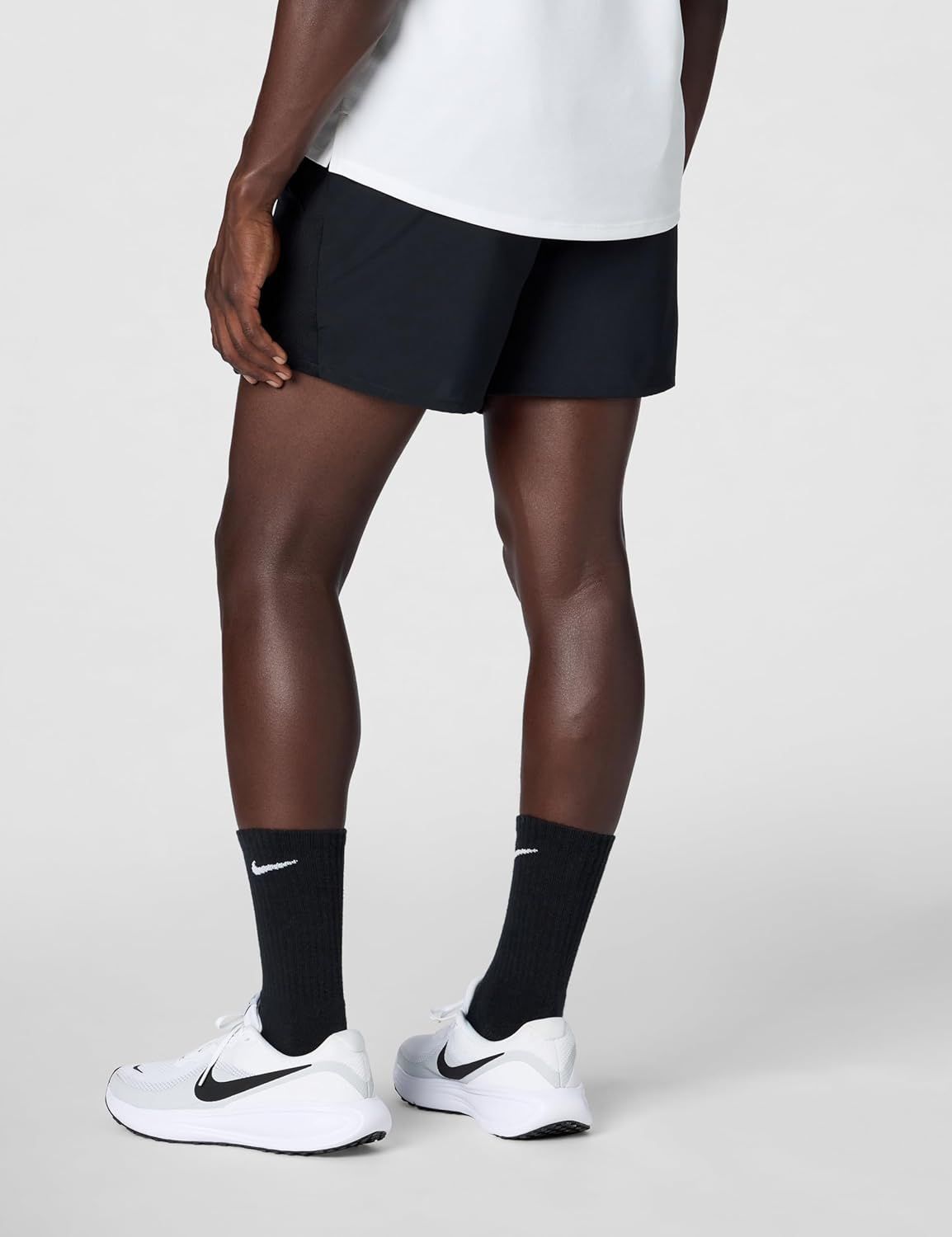 Displays the athletic shorts on a model in a clean, catalog-style format to show fit, length, and overall appearance without distractions.