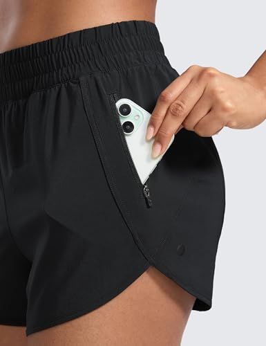 Demonstrates the convenient zippered pocket feature that securely holds a phone during workouts, reassuring shoppers about practical storage while exercising.