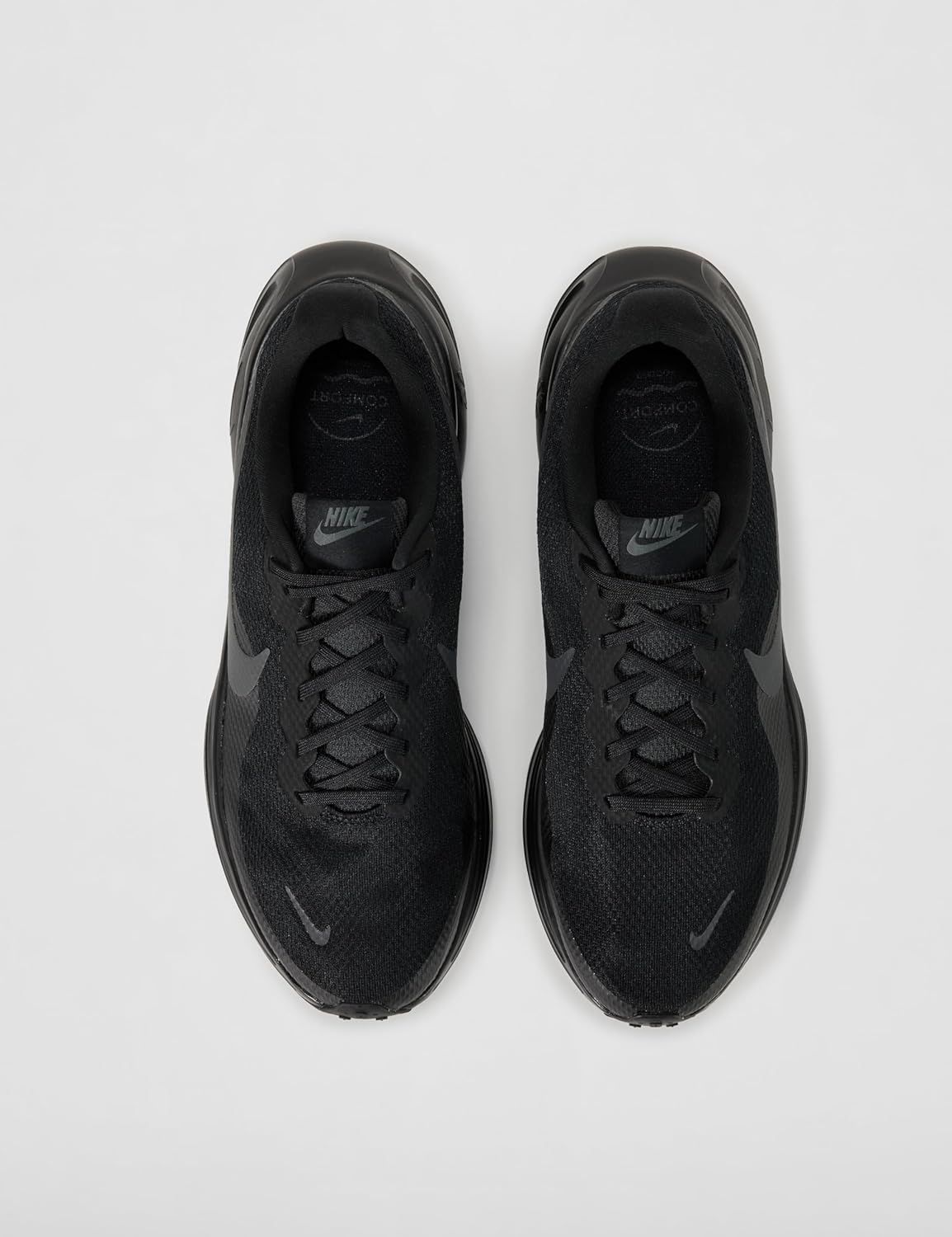Provides a clean, catalog-style view of the Nike shoes from above to show the product design and appearance without distractions.